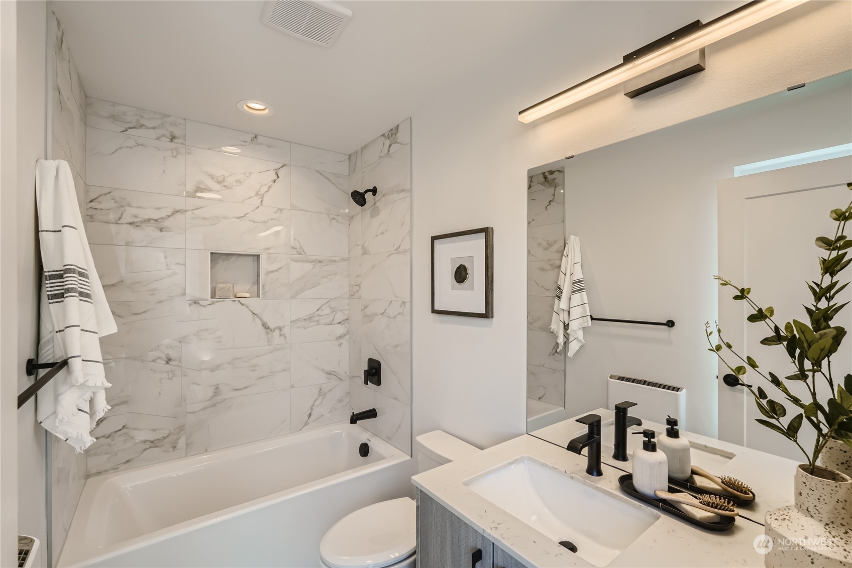 9524 3rd Avenue Northeast, Unit B Seattle, WA 98115 - Photo 12 of 21 a bathroom with a sink toilet and shower