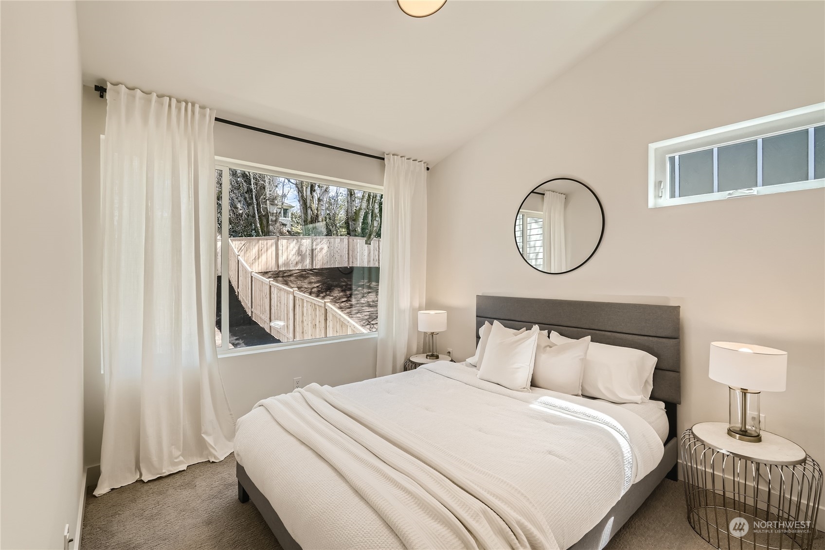 9524 3rd Avenue Northeast, Unit B Seattle, WA 98115 - Photo 13 of 21 a bedroom with a bed and a window