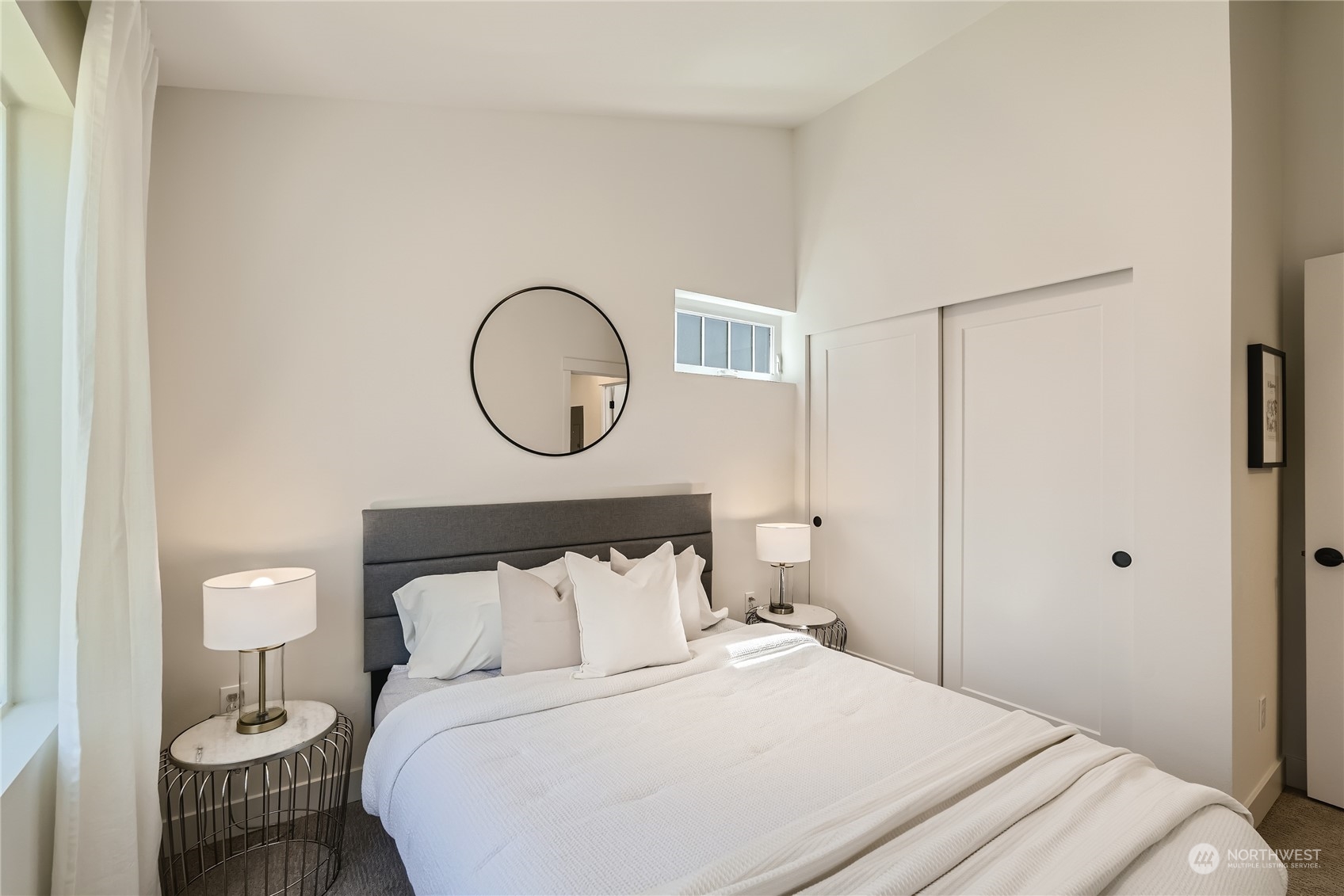 9524 3rd Avenue Northeast, Unit B Seattle, WA 98115 - Photo 14 of 21 a bedroom with a bed and a lamp with the table