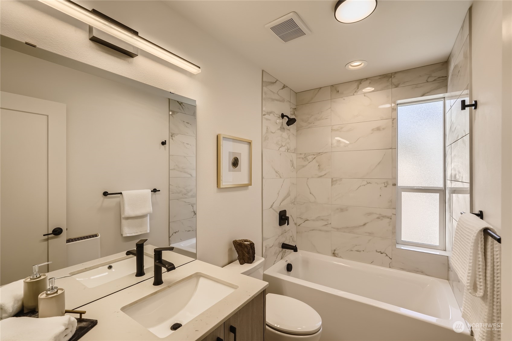 9524 3rd Avenue Northeast, Unit B Seattle, WA 98115 - Photo 15 of 21 a bathroom with a sink toilet tub and shower