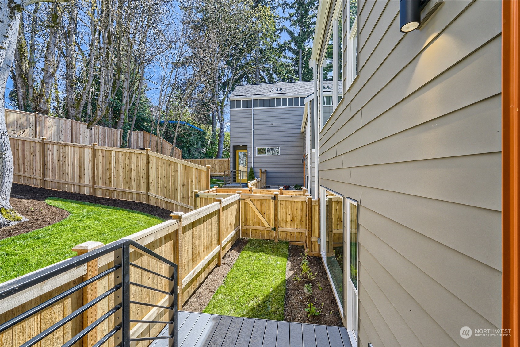9524 3rd Avenue Northeast, Unit B Seattle, WA 98115 - Photo 20 of 21 a view of balcony with wooden floor and fence