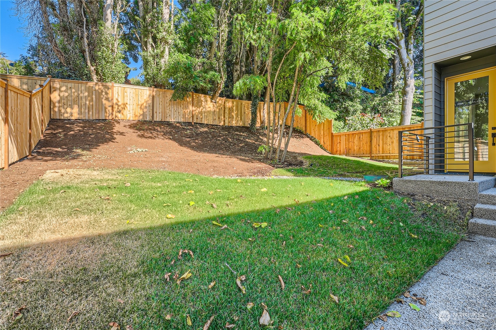 9524 3rd Avenue Northeast, Unit B Seattle, WA 98115 - Photo 2 of 21 a view of a yard with palm tree