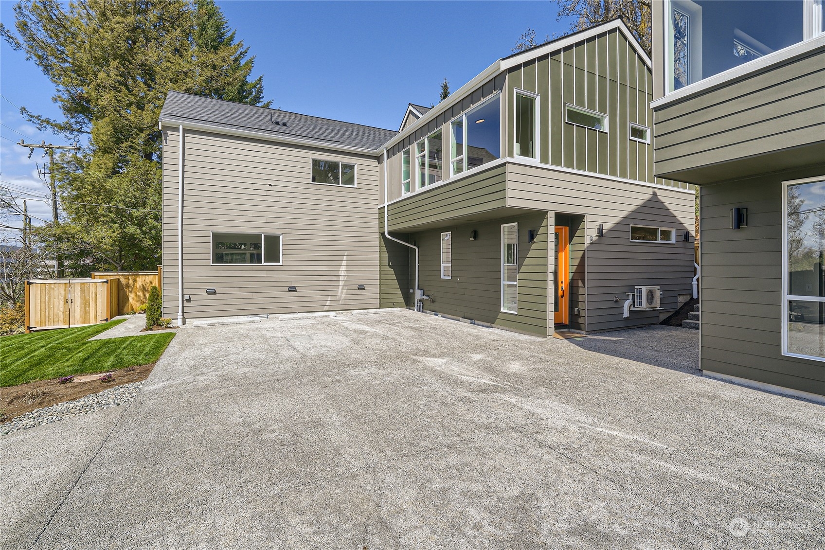 9524 3rd Avenue Northeast, Unit B Seattle, WA 98115 - Photo 21 of 21 a front view of a house with a yard and garage