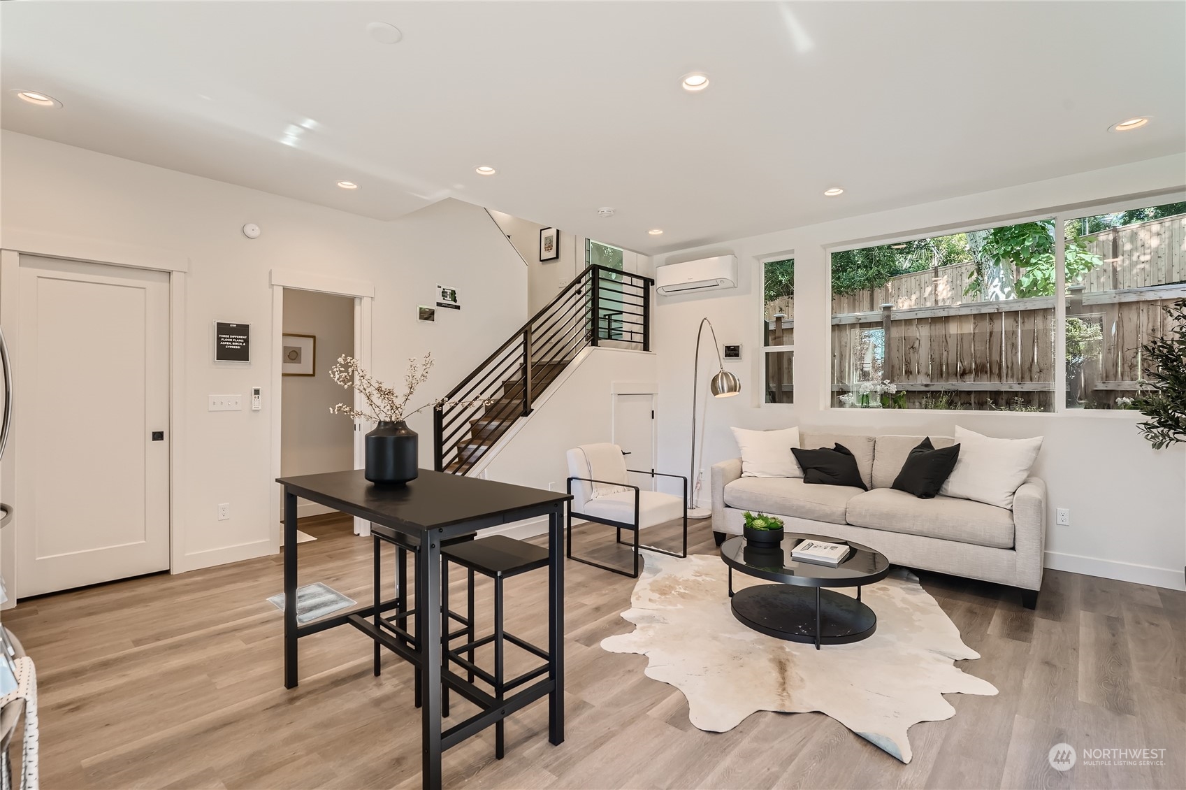 9524 3rd Avenue Northeast, Unit B Seattle, WA 98115 - Photo 3 of 21 a living room with furniture and wooden floor