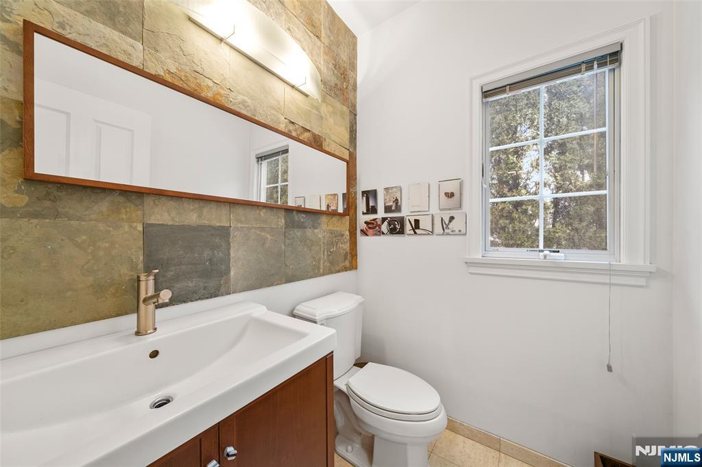 137 6th Street Cresskill, NJ 07626 - Photo 15 of 35 a bathroom with a sink a toilet and a bathtub