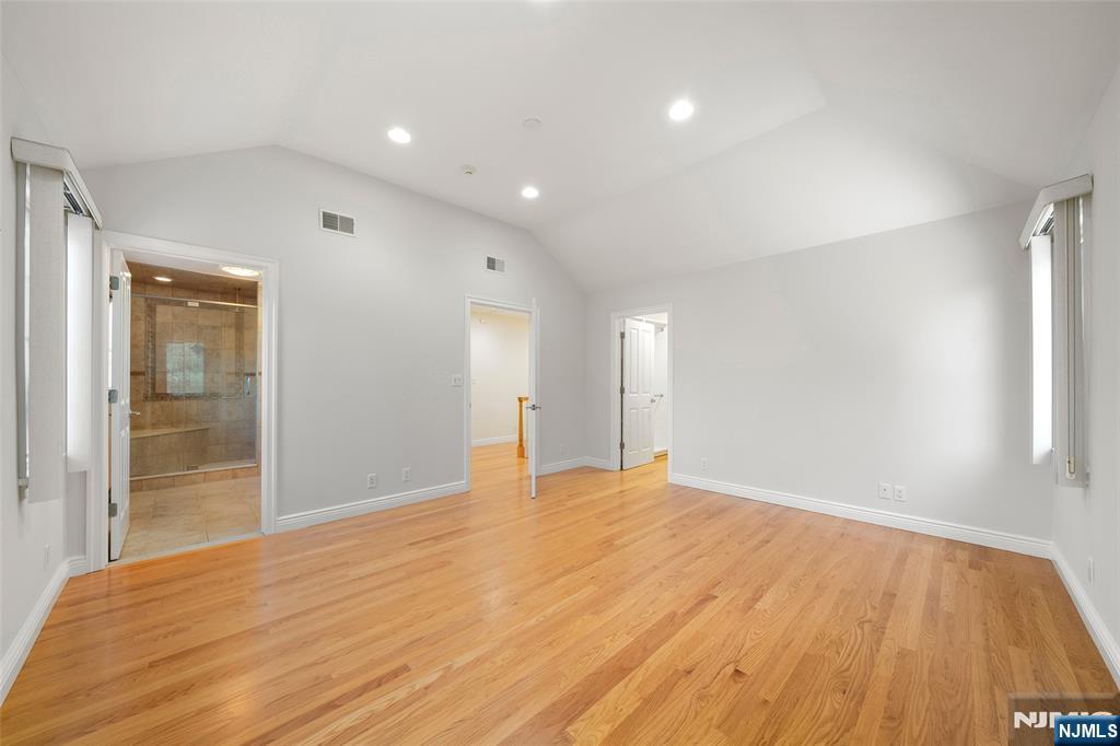 137 6th Street Cresskill, NJ 07626 - Photo 17 of 35 a view of an empty room with wooden floor and a window