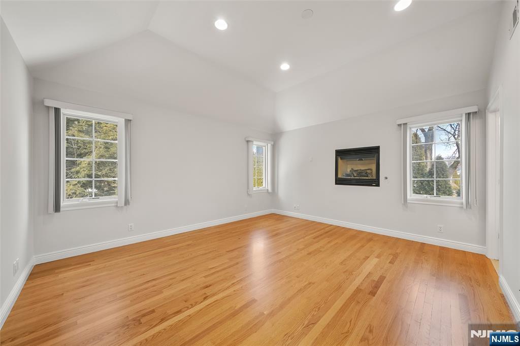 137 6th Street Cresskill, NJ 07626 - Photo 18 of 35 a view of empty room with wooden floor and fan