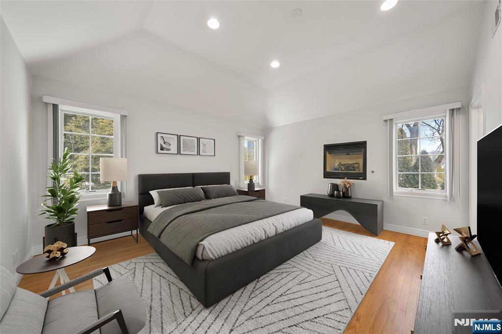 137 6th Street Cresskill, NJ 07626 - Photo 19 of 35 a bedroom with a bed and a potted plant