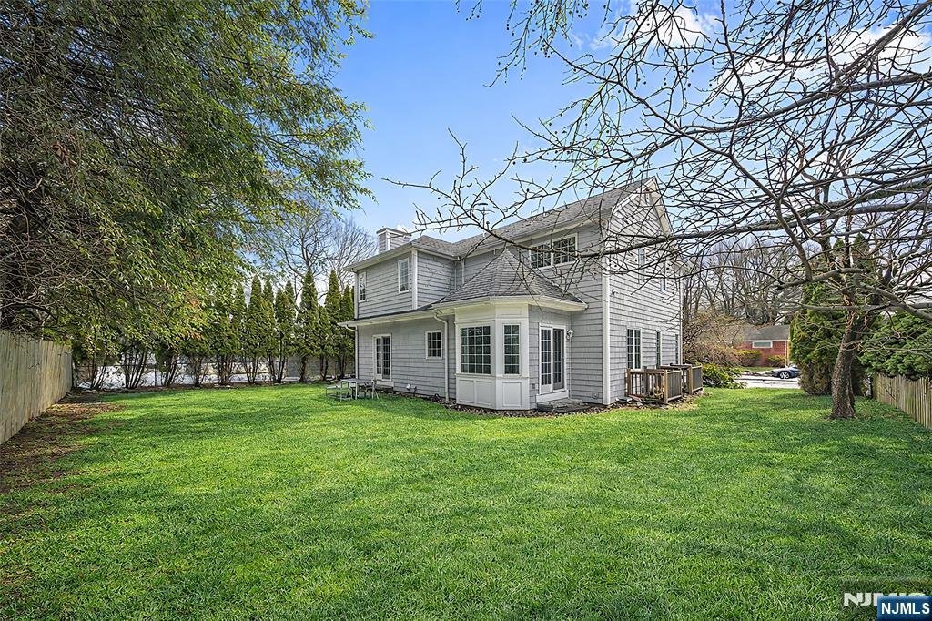 137 6th Street Cresskill, NJ 07626 - Photo 34 of 35 a white house that has a tree in front of it