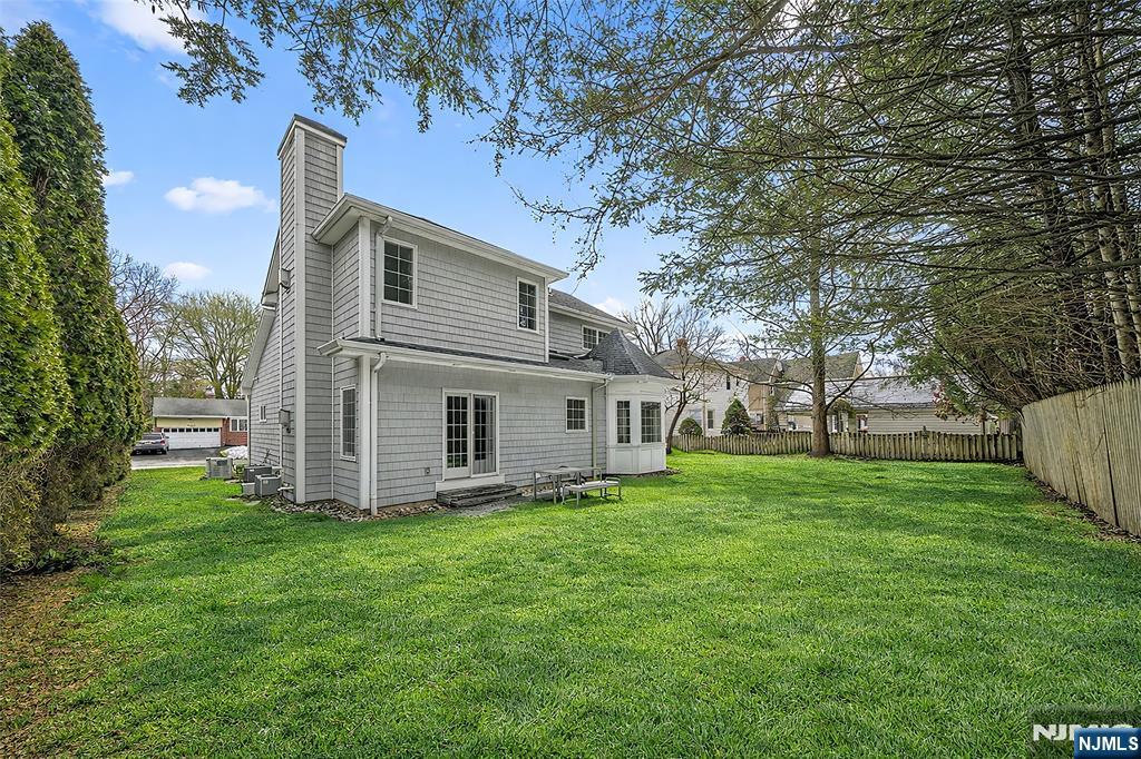 137 6th Street Cresskill, NJ 07626 - Photo 35 of 35 a white house that has a tree in front of it