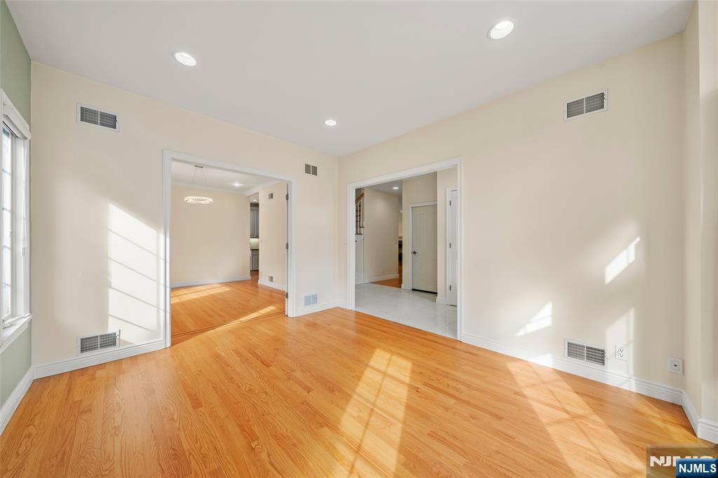 137 6th Street Cresskill, NJ 07626 - Photo 5 of 35 a bedroom with a bed and a chandelier