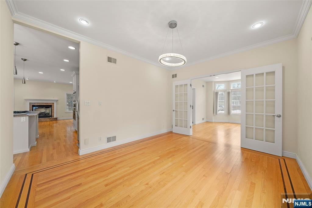 137 6th Street Cresskill, NJ 07626 - Photo 9 of 35 a bedroom with a bed and a large window