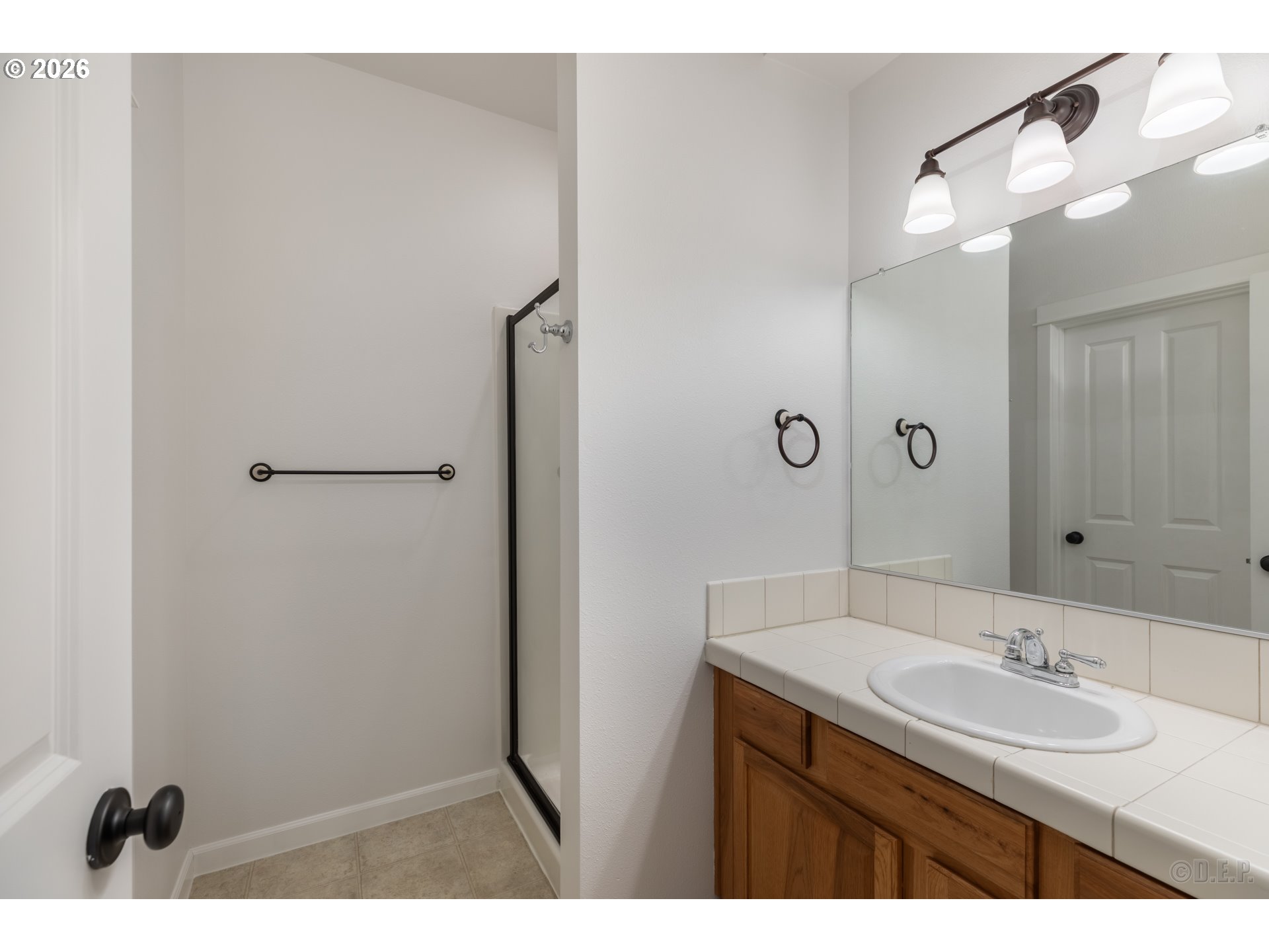9161 Northwest Germantown Road Portland, OR 97231 - Photo 13 of 28 a bathroom with a sink and a mirror
