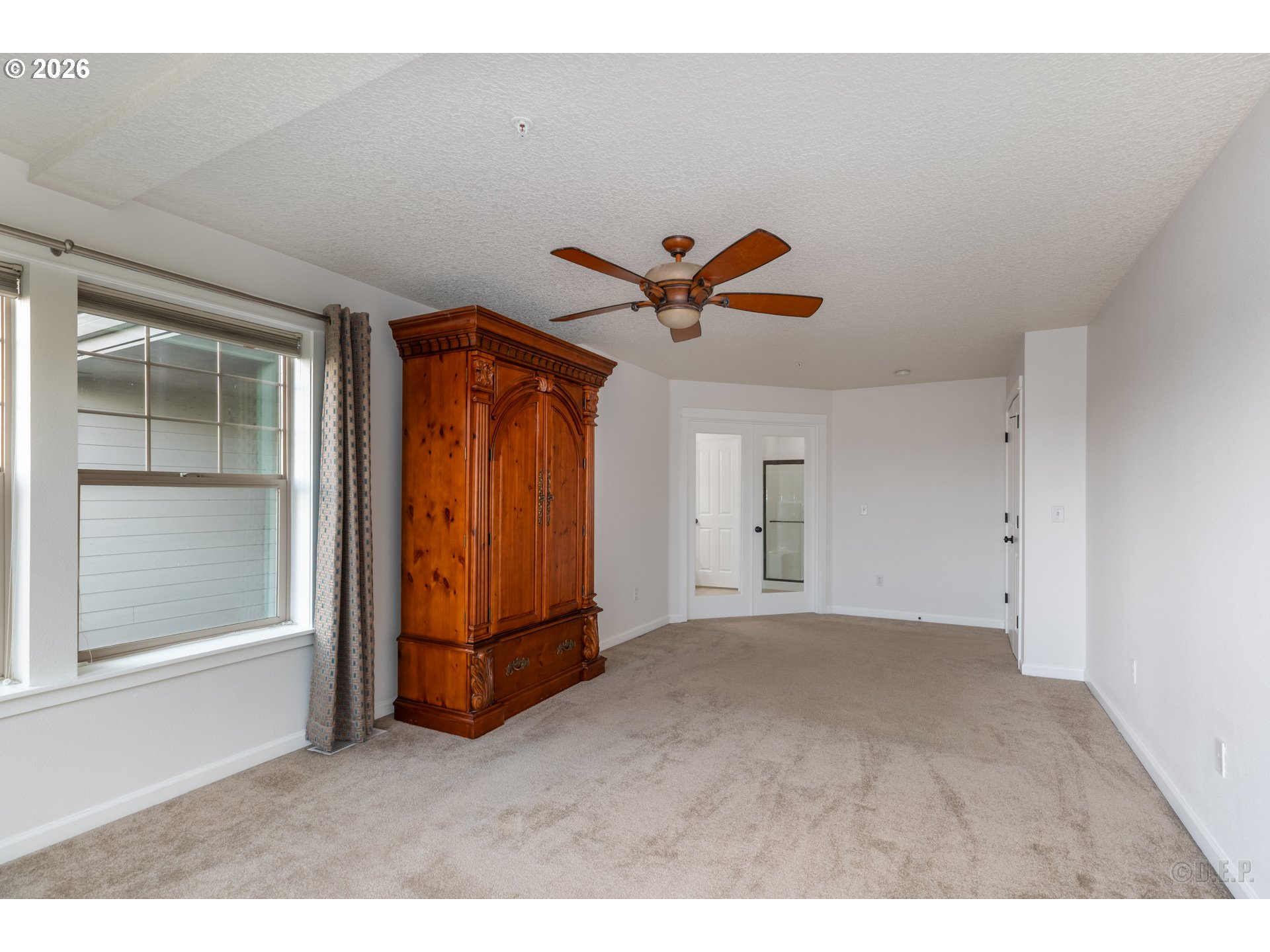 9161 Northwest Germantown Road Portland, OR 97231 - Photo 15 of 28 a view of a livingroom with a ceiling fan and window