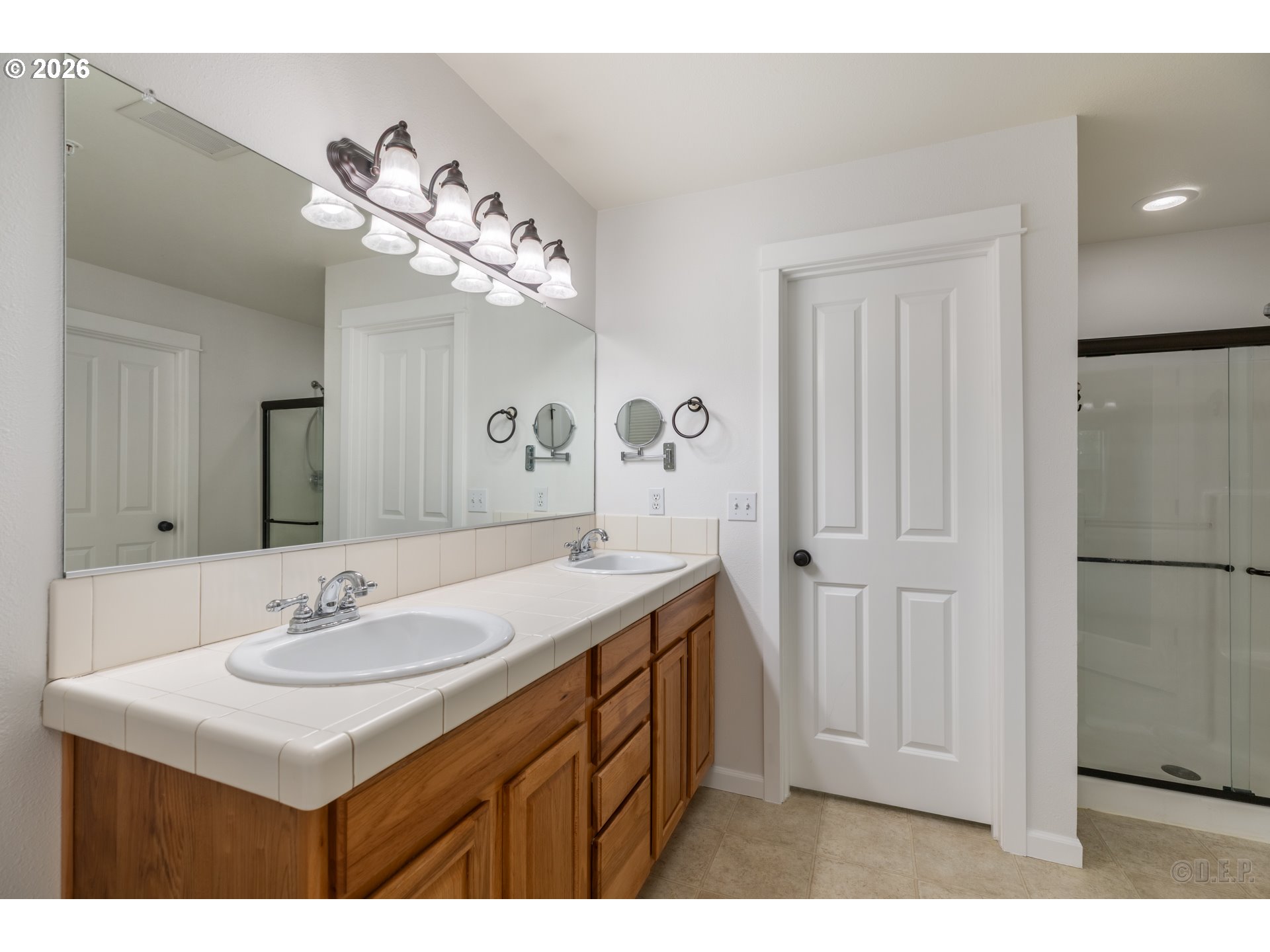 9161 Northwest Germantown Road Portland, OR 97231 - Photo 17 of 28 a bathroom with a sink a mirror and a shower