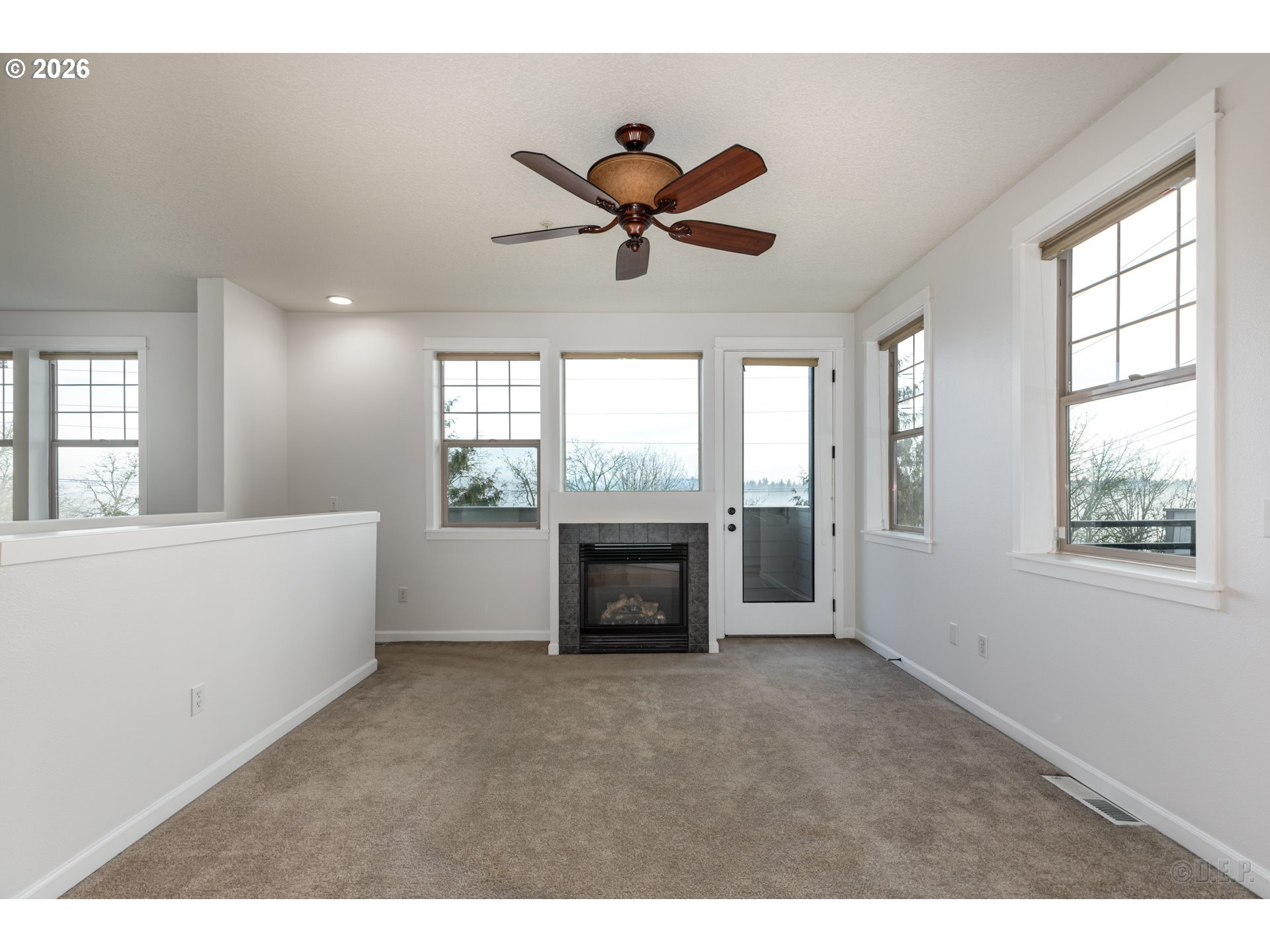 9161 Northwest Germantown Road Portland, OR 97231 - Photo 5 of 28 a view of an empty room with a fireplace and a window