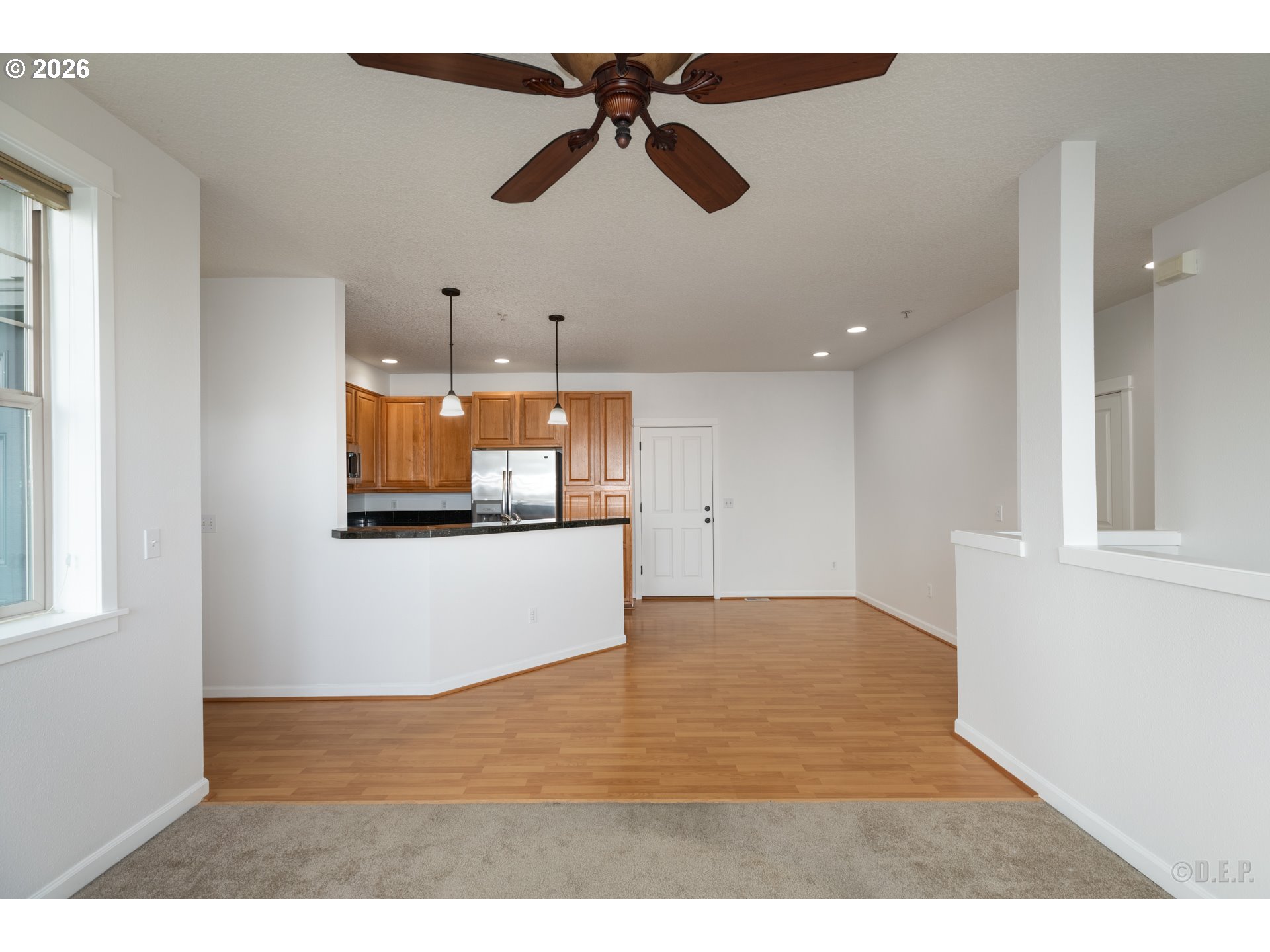9161 Northwest Germantown Road Portland, OR 97231 - Photo 6 of 28 a view of an empty room with window and wooden floor