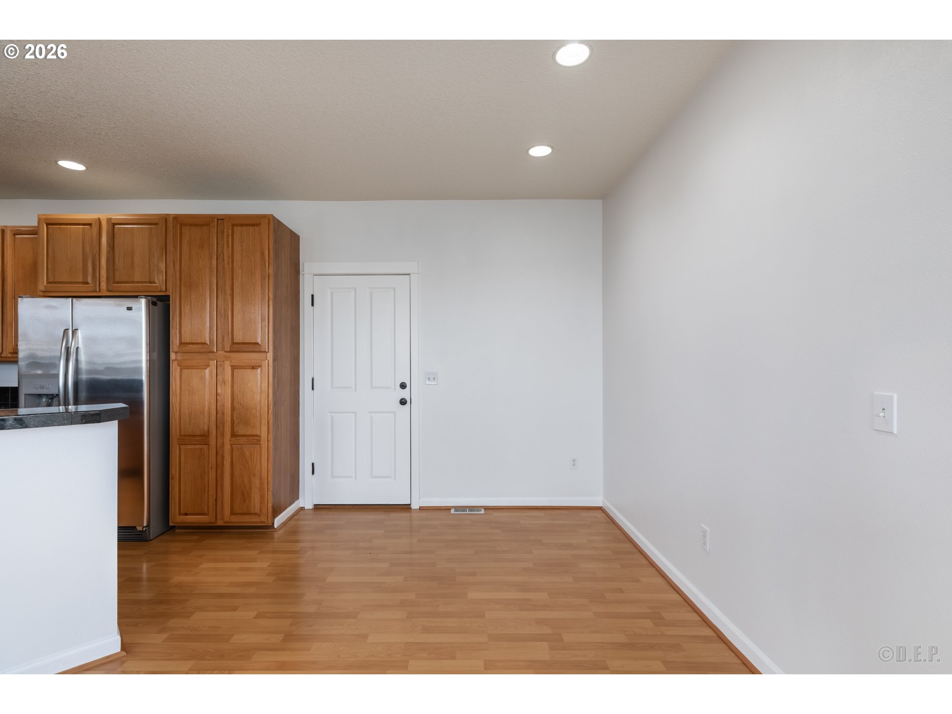 9161 Northwest Germantown Road Portland, OR 97231 - Photo 7 of 28 a view of an empty room with wooden floor