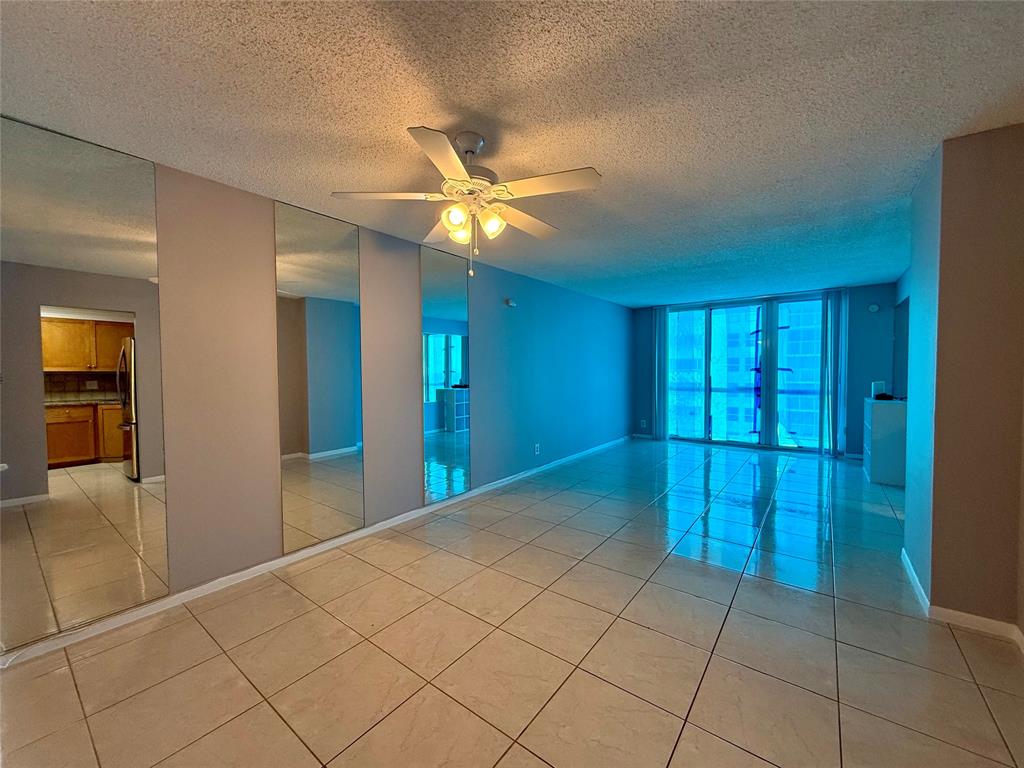 101 Briny Avenue, Unit 1606 Pompano Beach, FL 33062 - Photo 4 of 25 a view of hallway with chandelier fan and window