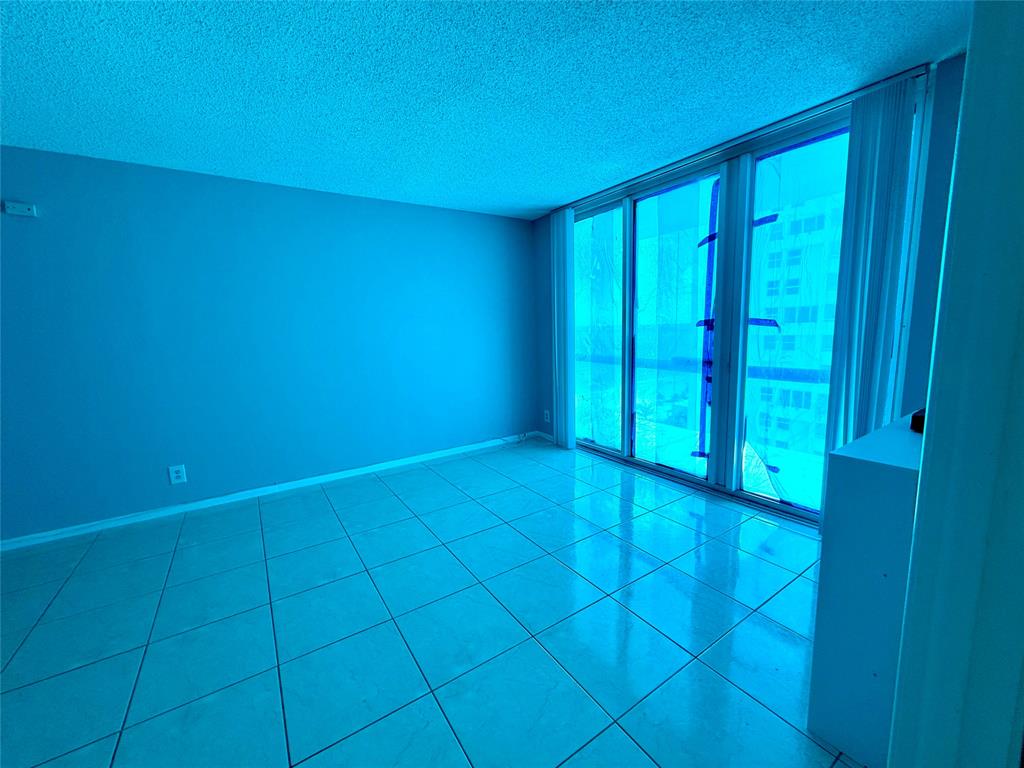101 Briny Avenue, Unit 1606 Pompano Beach, FL 33062 - Photo 7 of 25 a view of an empty room with a window