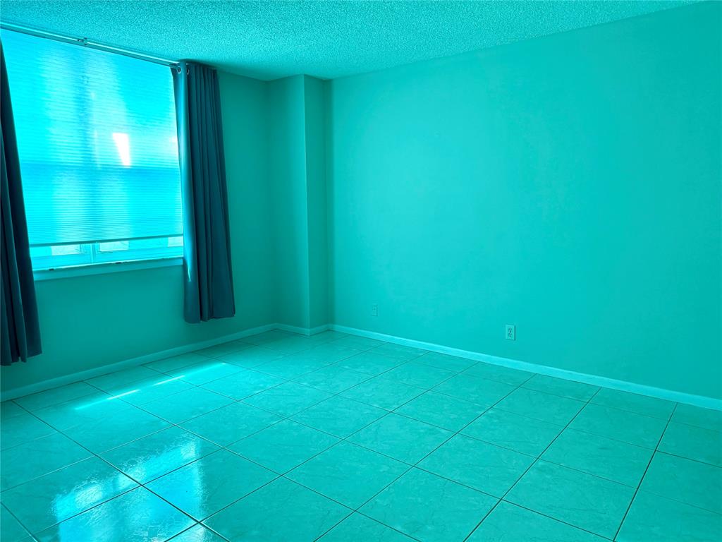 101 Briny Avenue, Unit 1606 Pompano Beach, FL 33062 - Photo 9 of 25 a view of yellow wall