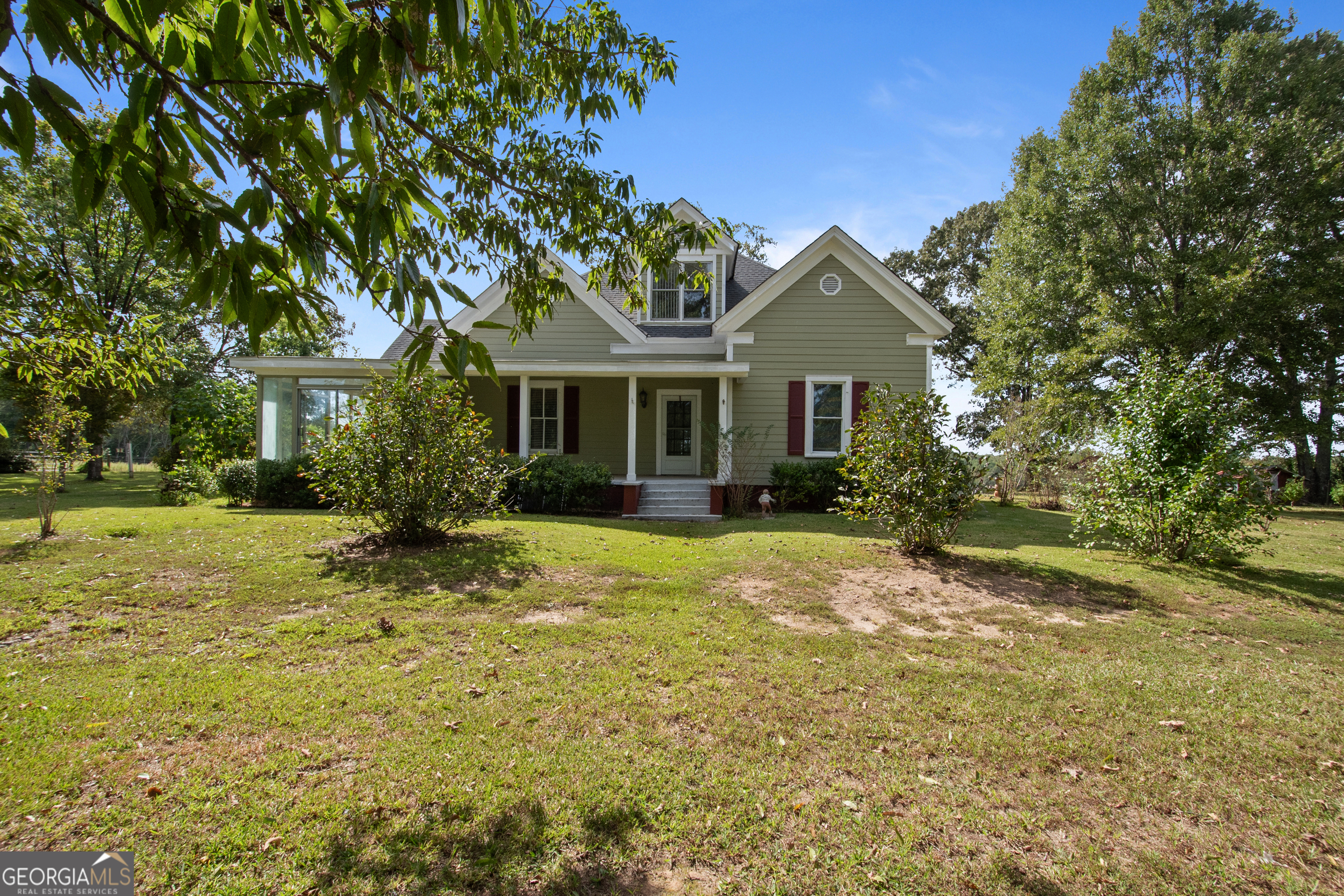 402 Tom Bell Road Milner, GA 30257 - Photo 1 of 64 a front view of a house with a yard