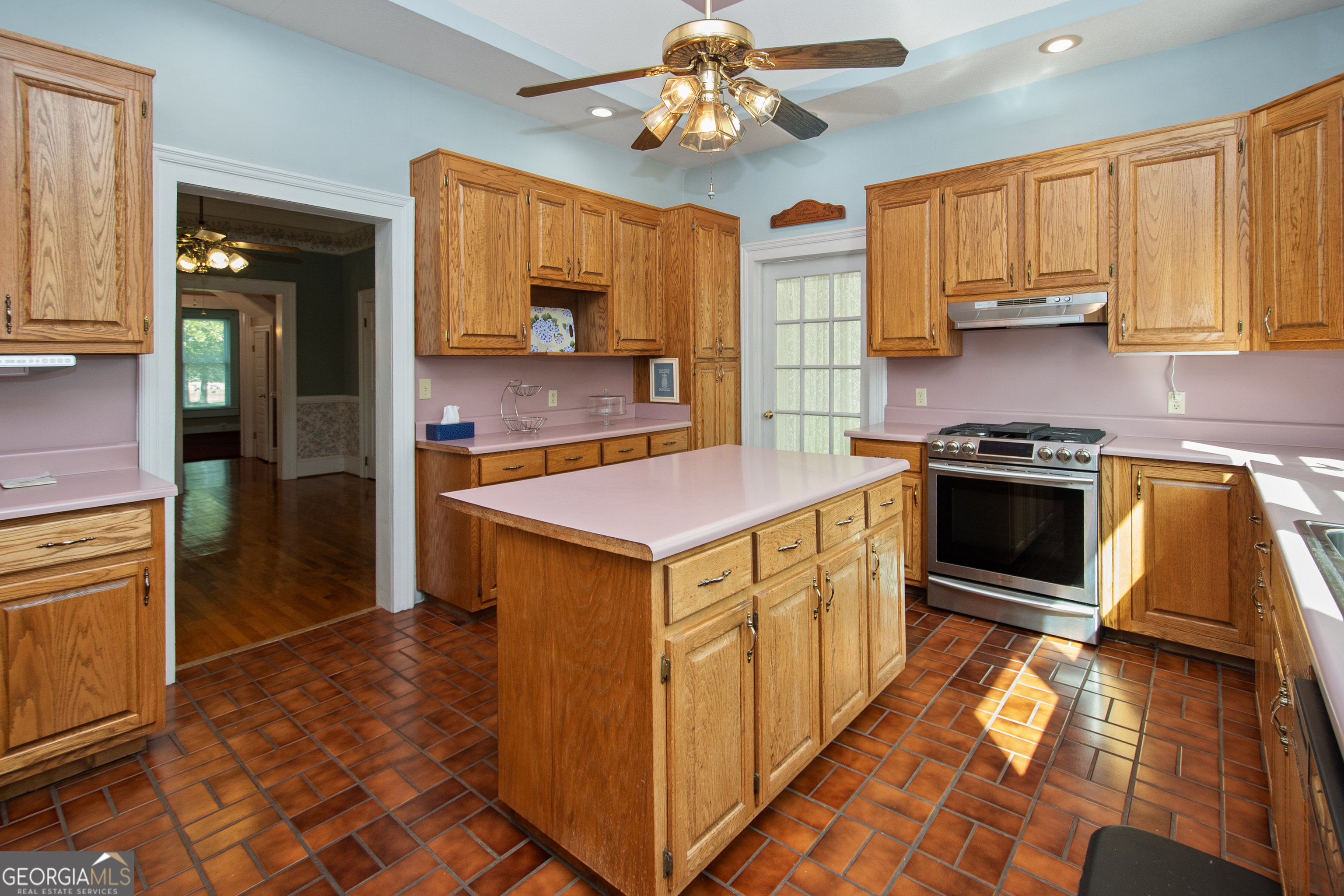 402 Tom Bell Road Milner, GA 30257 - Photo 13 of 64 a kitchen with stainless steel appliances granite countertop a stove refrigerator and microwave