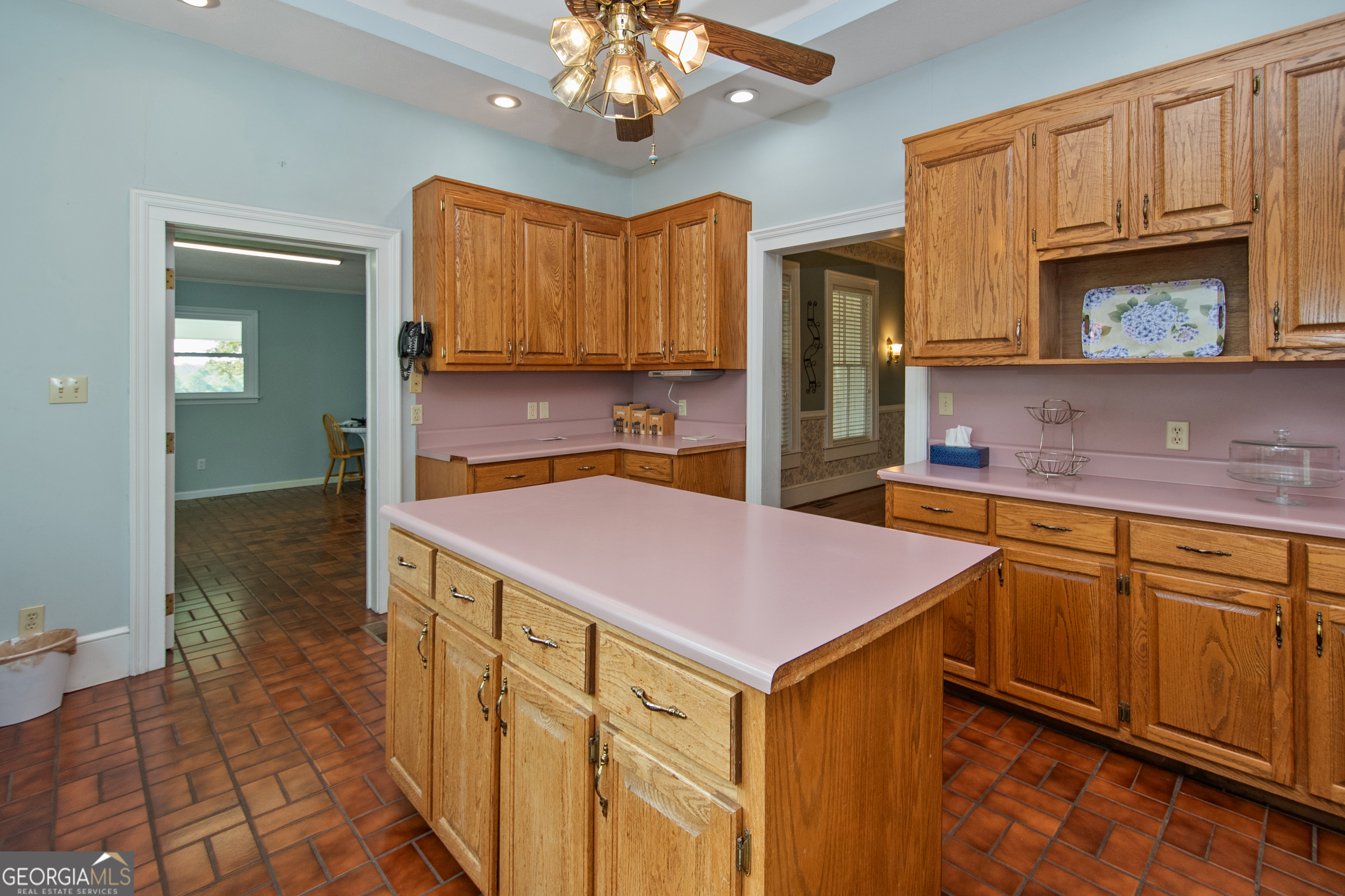 402 Tom Bell Road Milner, GA 30257 - Photo 14 of 64 a kitchen with stainless steel appliances a sink cabinets and wooden floor