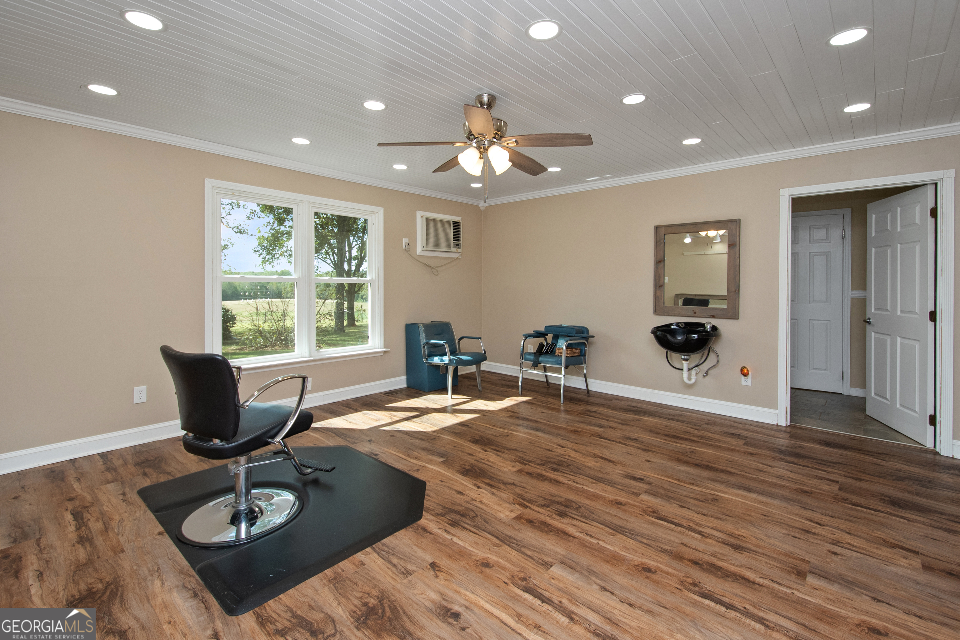 402 Tom Bell Road Milner, GA 30257 - Photo 18 of 64 a living room with furniture and a large window