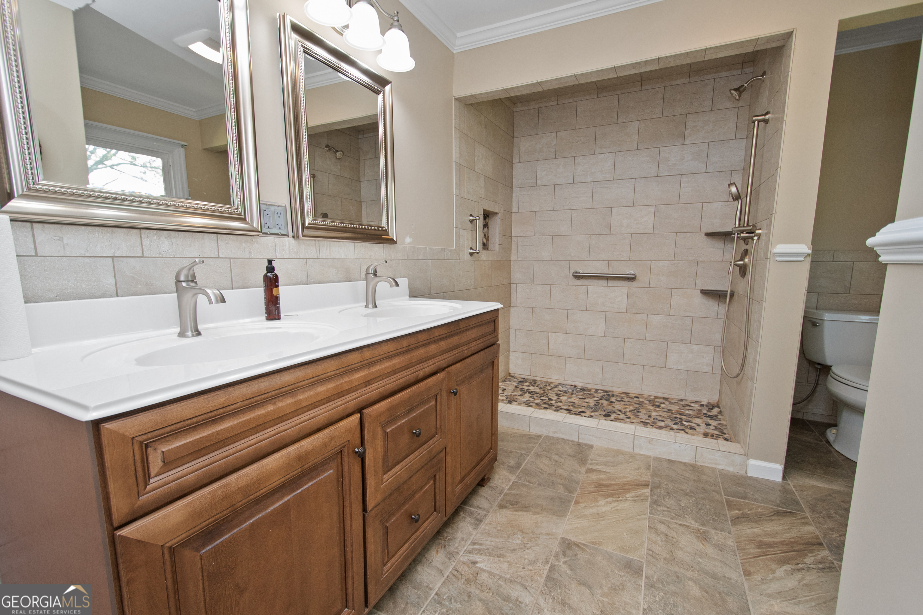 402 Tom Bell Road Milner, GA 30257 - Photo 20 of 64 a bathroom with a sink and a mirror