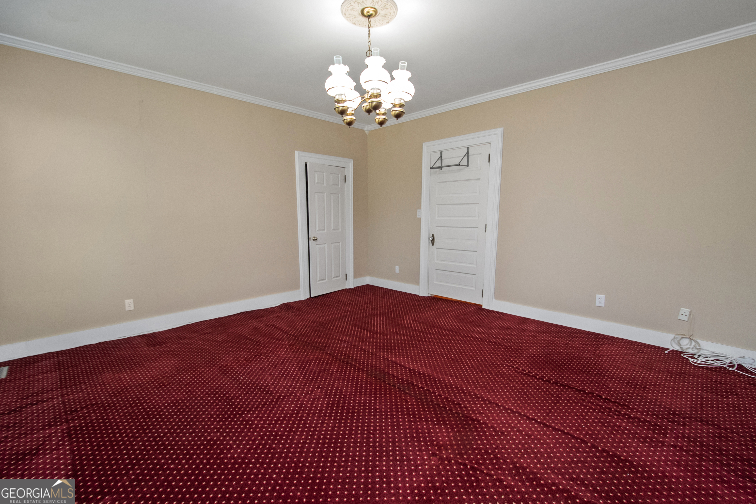 402 Tom Bell Road Milner, GA 30257 - Photo 24 of 64 a view of a bedroom with a chandelier fan and windows