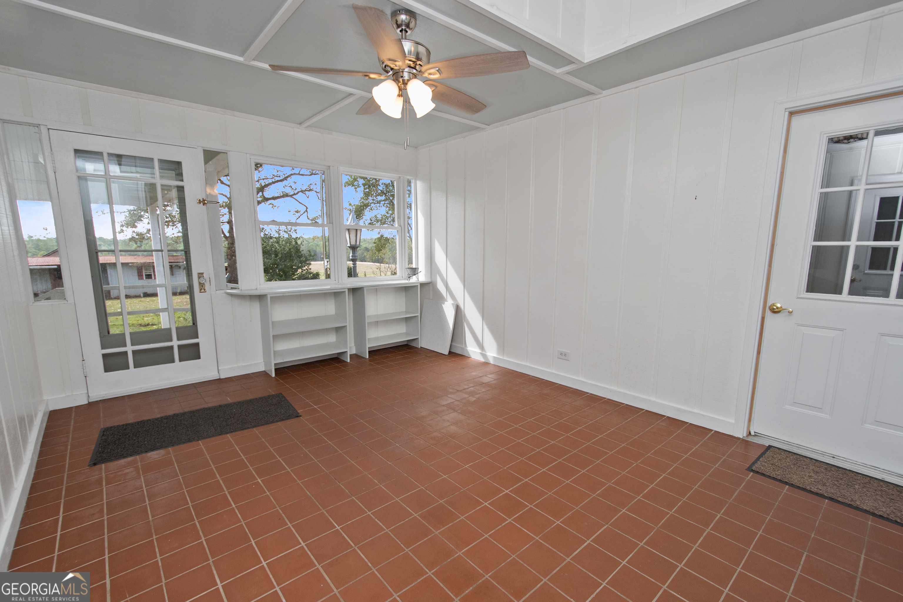 402 Tom Bell Road Milner, GA 30257 - Photo 36 of 64 wooden floor in an empty room with a window