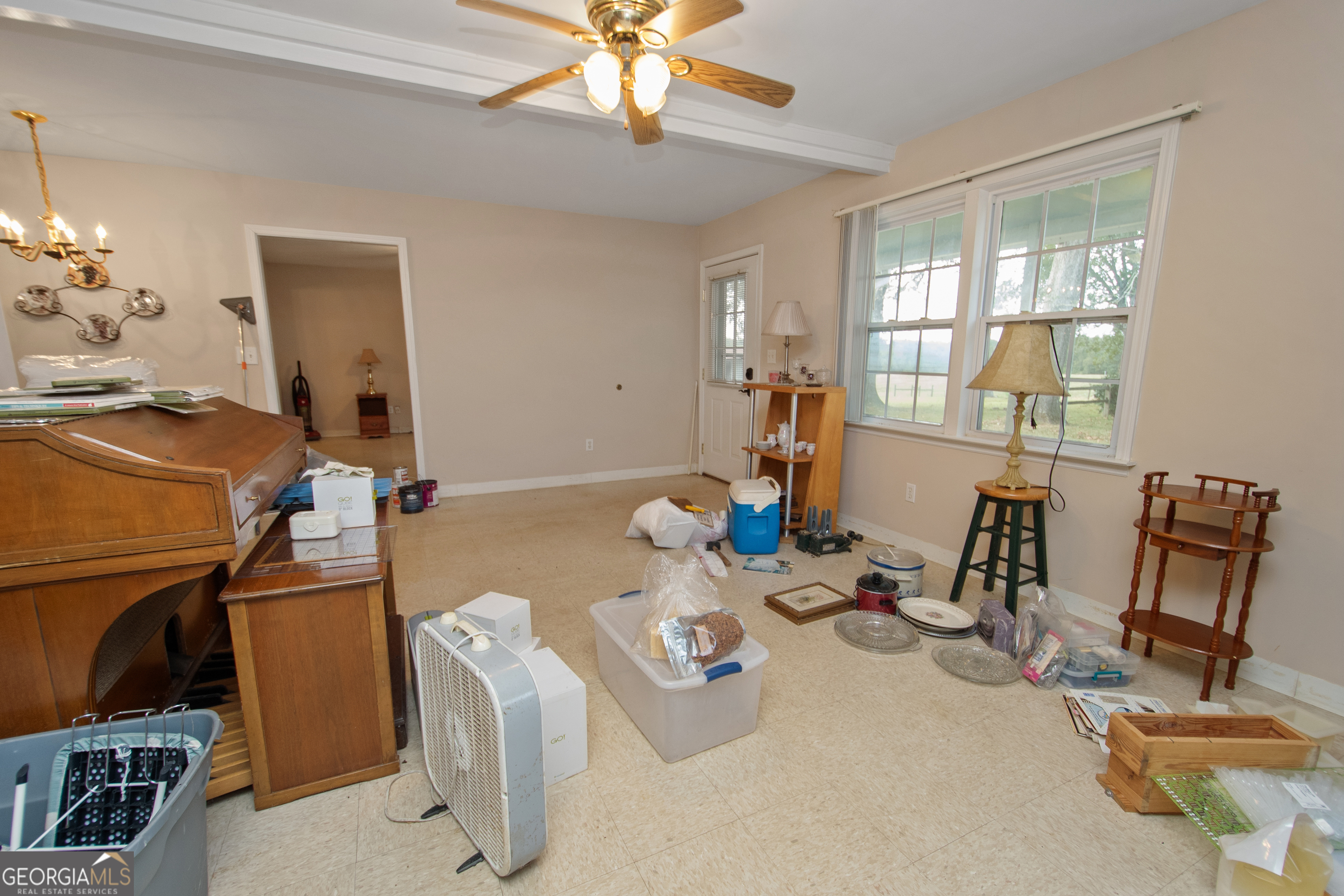 402 Tom Bell Road Milner, GA 30257 - Photo 38 of 64 a room with gym equipment and view of living room