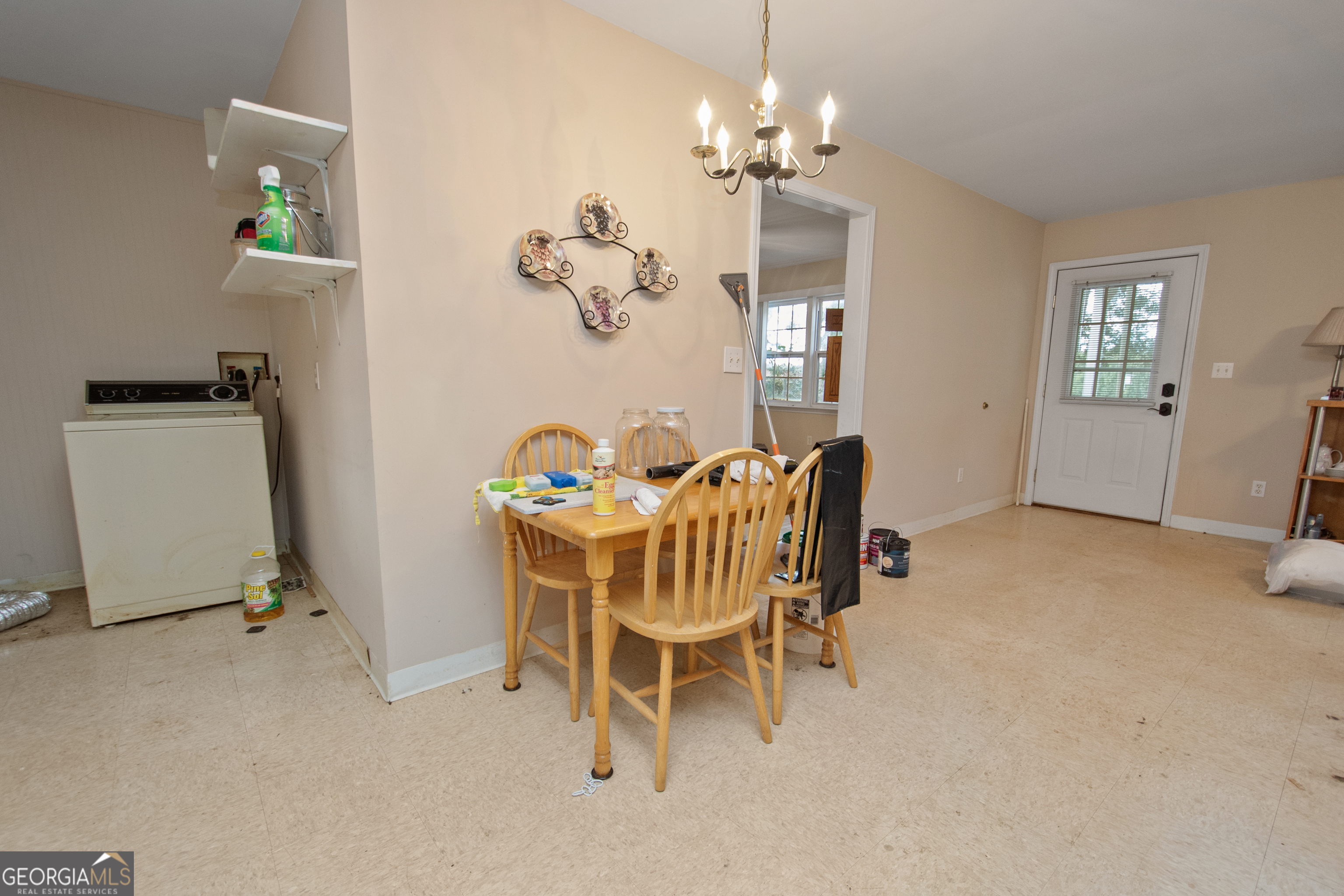 402 Tom Bell Road Milner, GA 30257 - Photo 42 of 64 a dining room with furniture and window