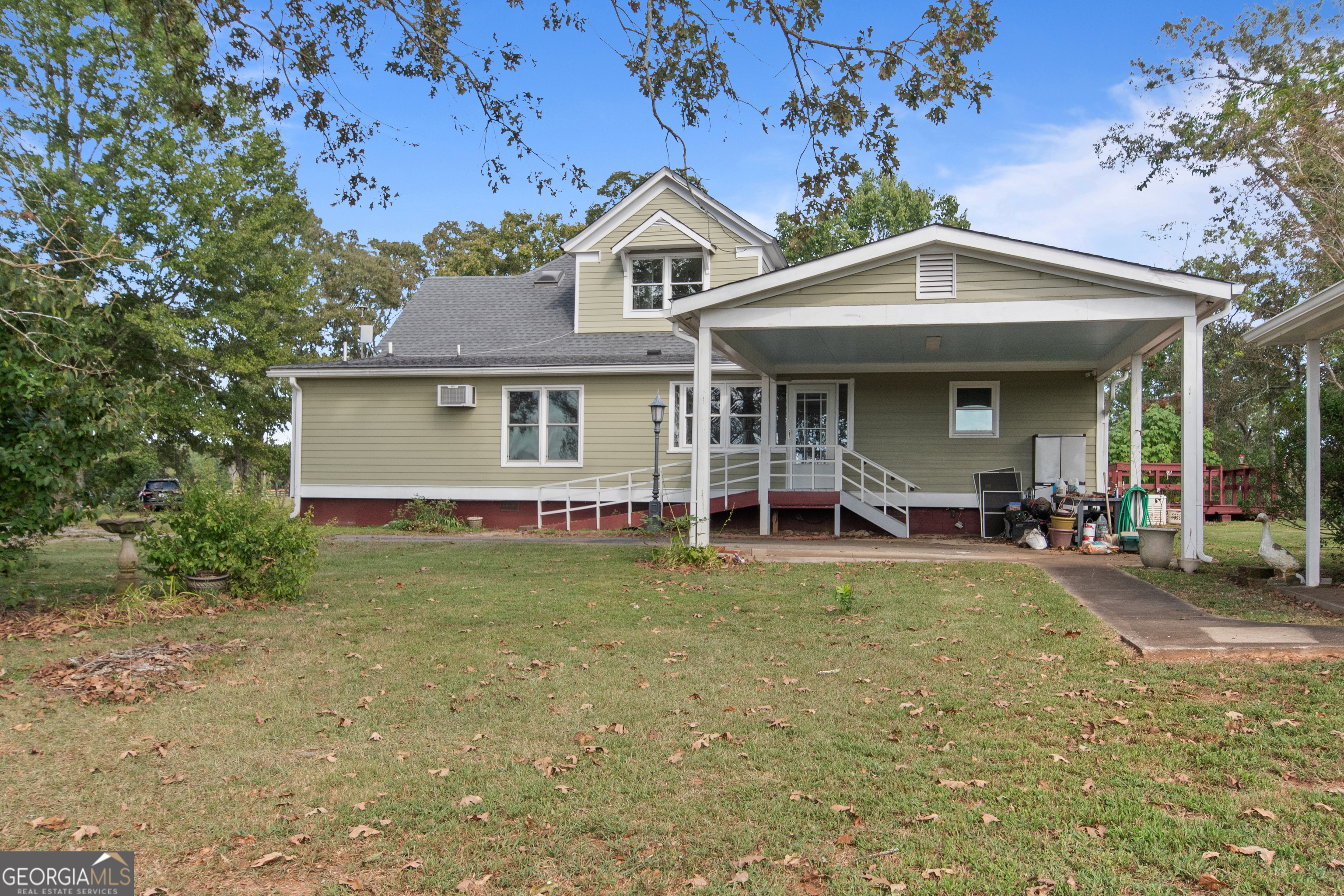 402 Tom Bell Road Milner, GA 30257 - Photo 47 of 64 a view of a house with a yard patio and fire pit