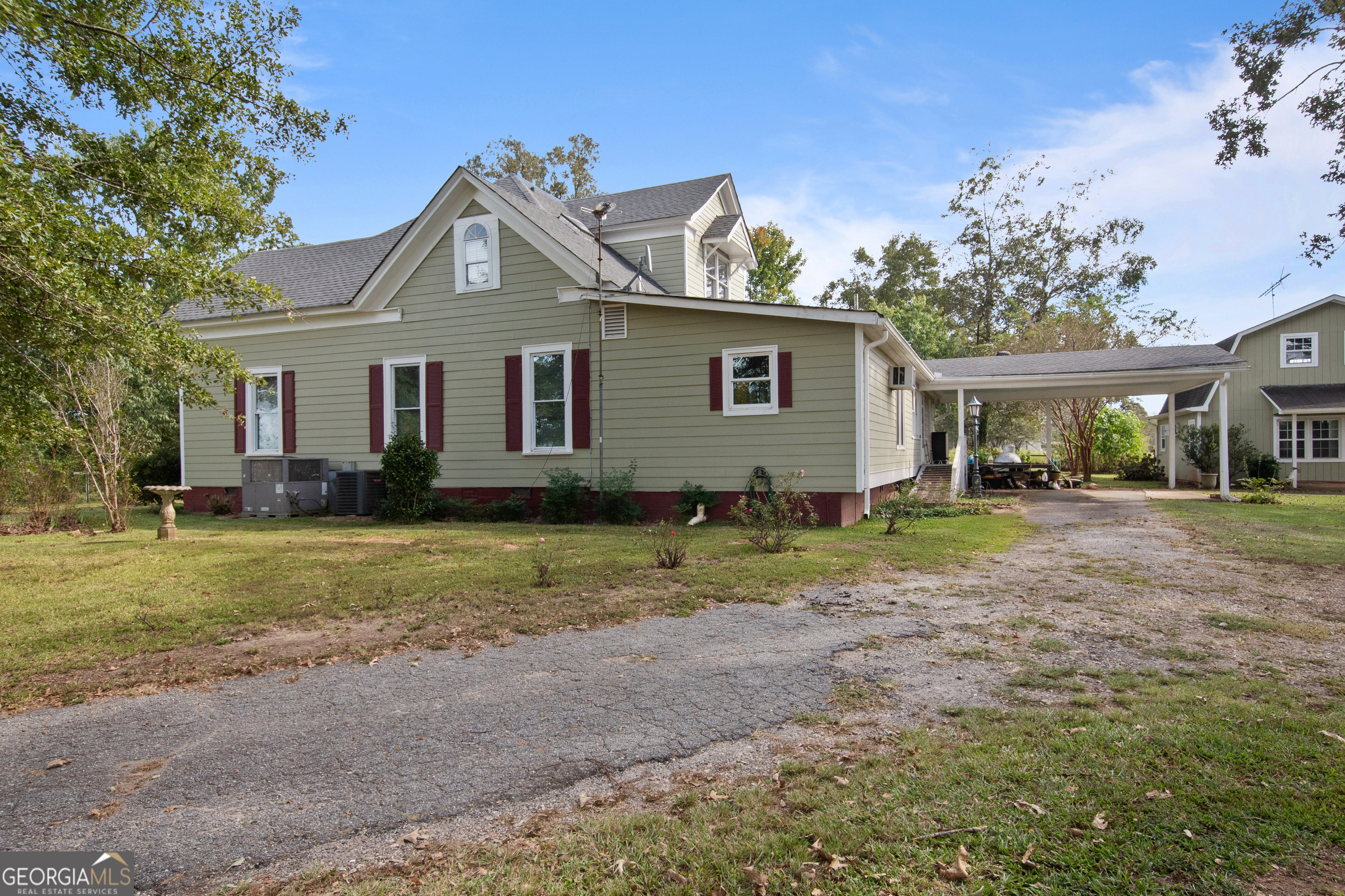 402 Tom Bell Road Milner, GA 30257 - Photo 48 of 64 a front view of a house with a yard