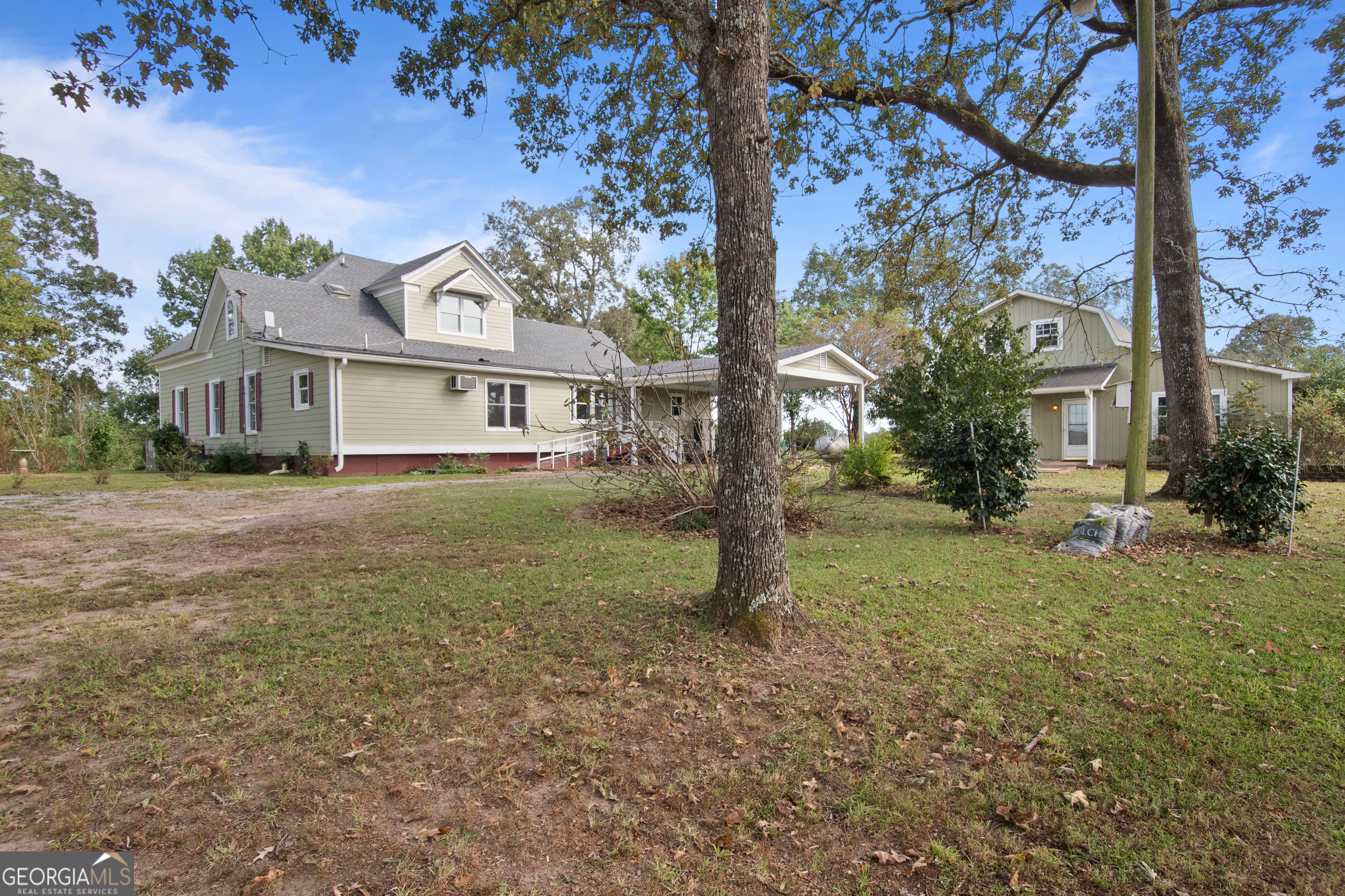 402 Tom Bell Road Milner, GA 30257 - Photo 49 of 64 a view of a house with a yard