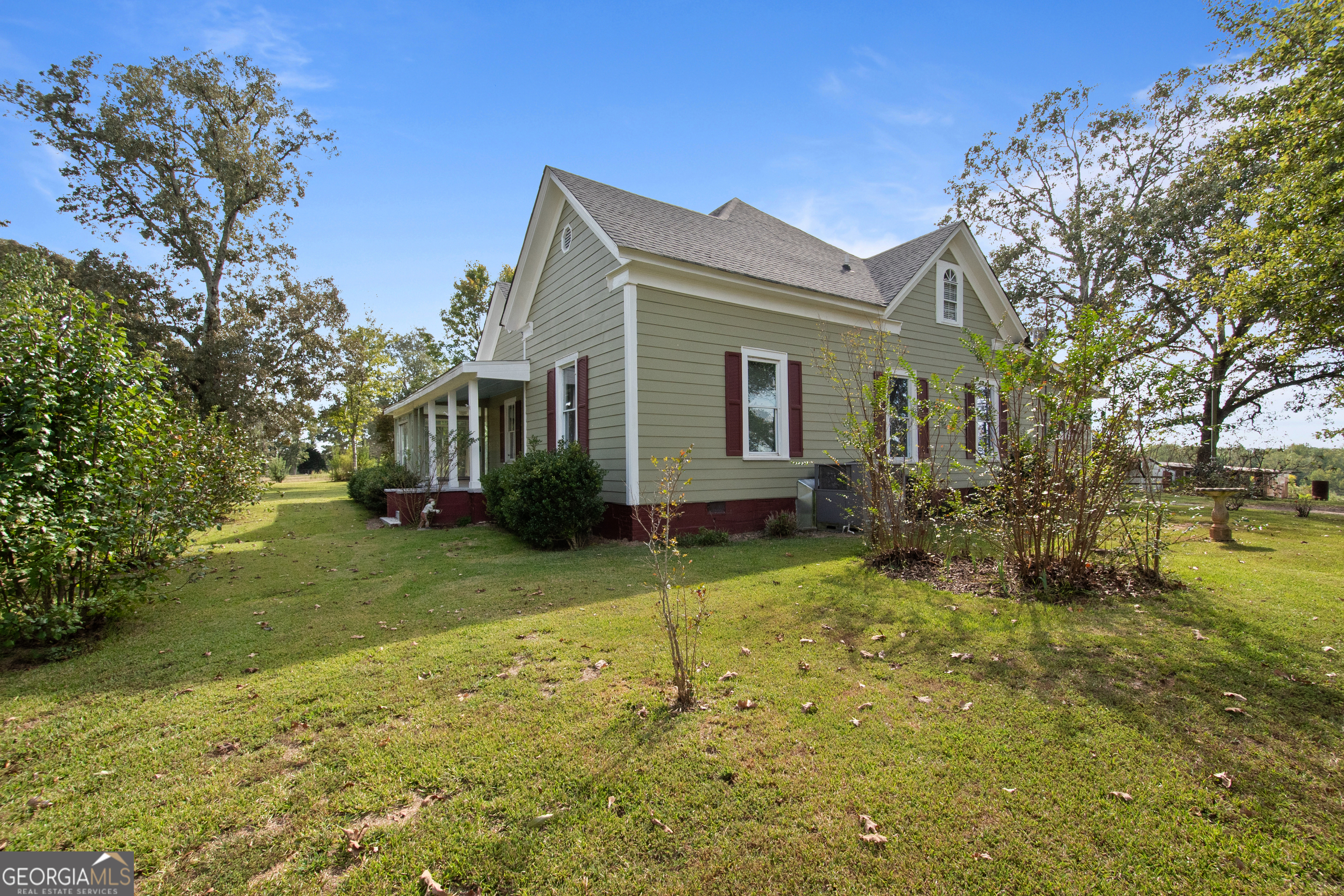 402 Tom Bell Road Milner, GA 30257 - Photo 50 of 64 a view of a house with a yard