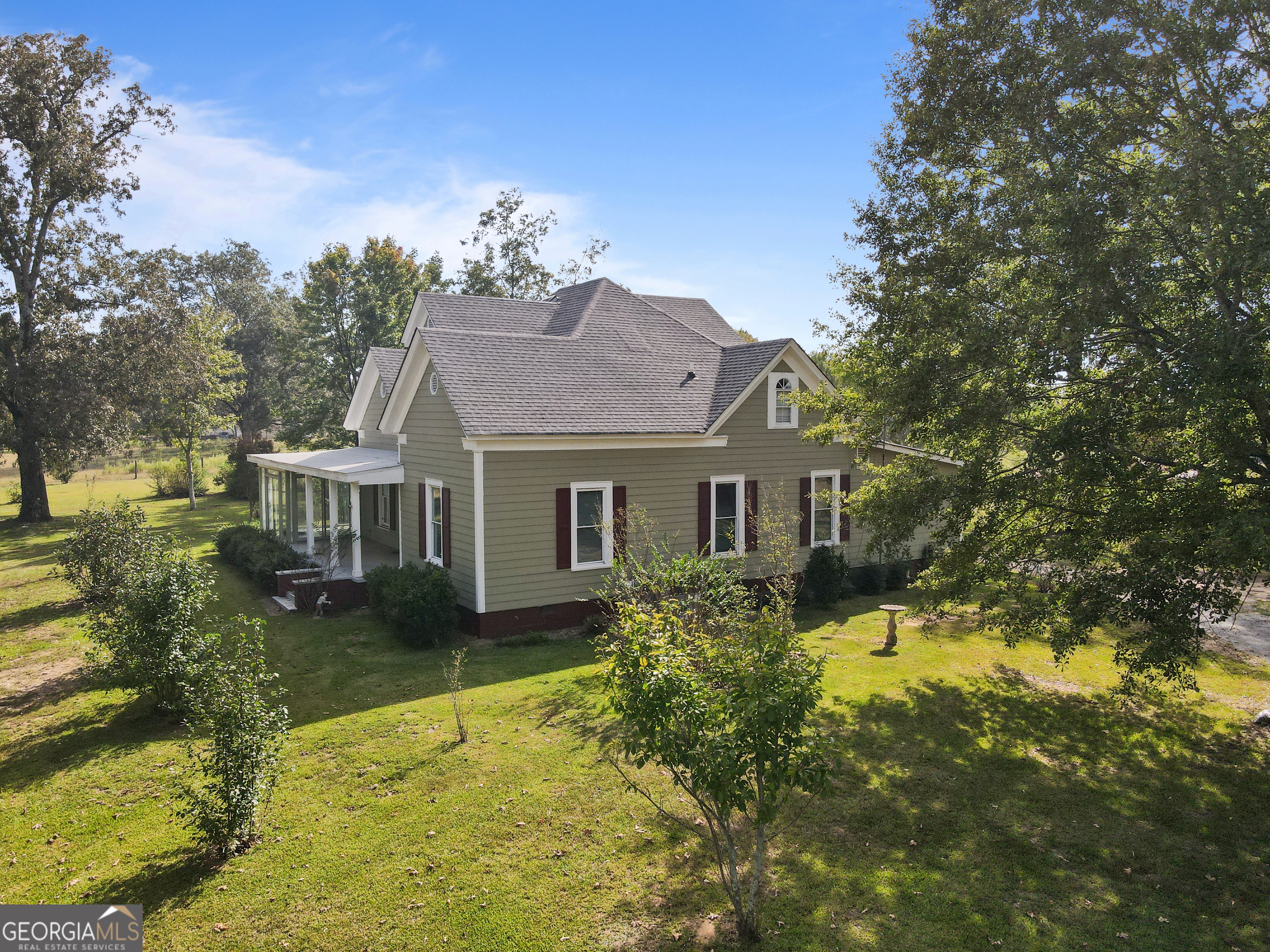 402 Tom Bell Road Milner, GA 30257 - Photo 51 of 64 a aerial view of a house with swimming pool next to a yard
