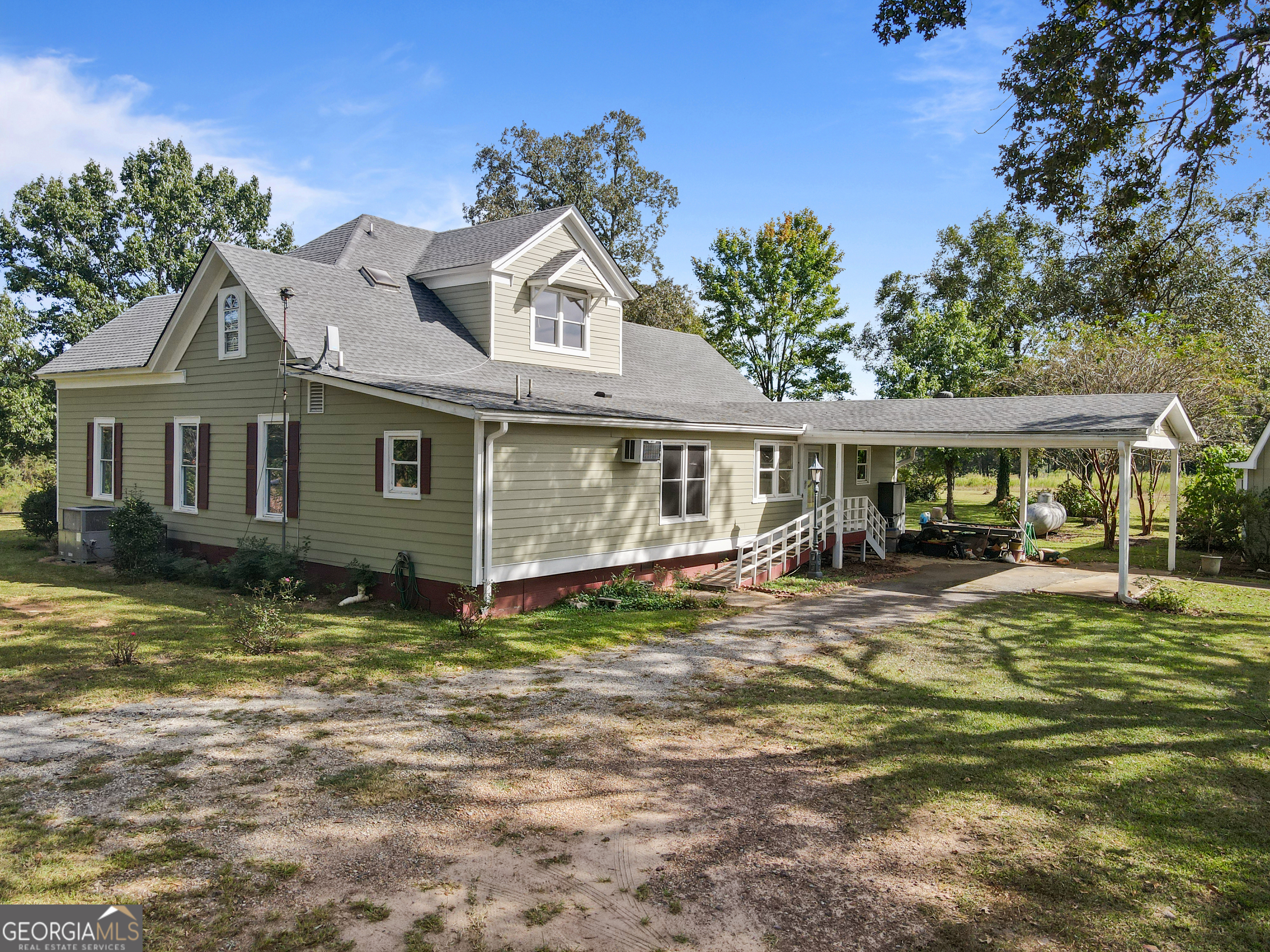 402 Tom Bell Road Milner, GA 30257 - Photo 52 of 64 a front view of a house with garden