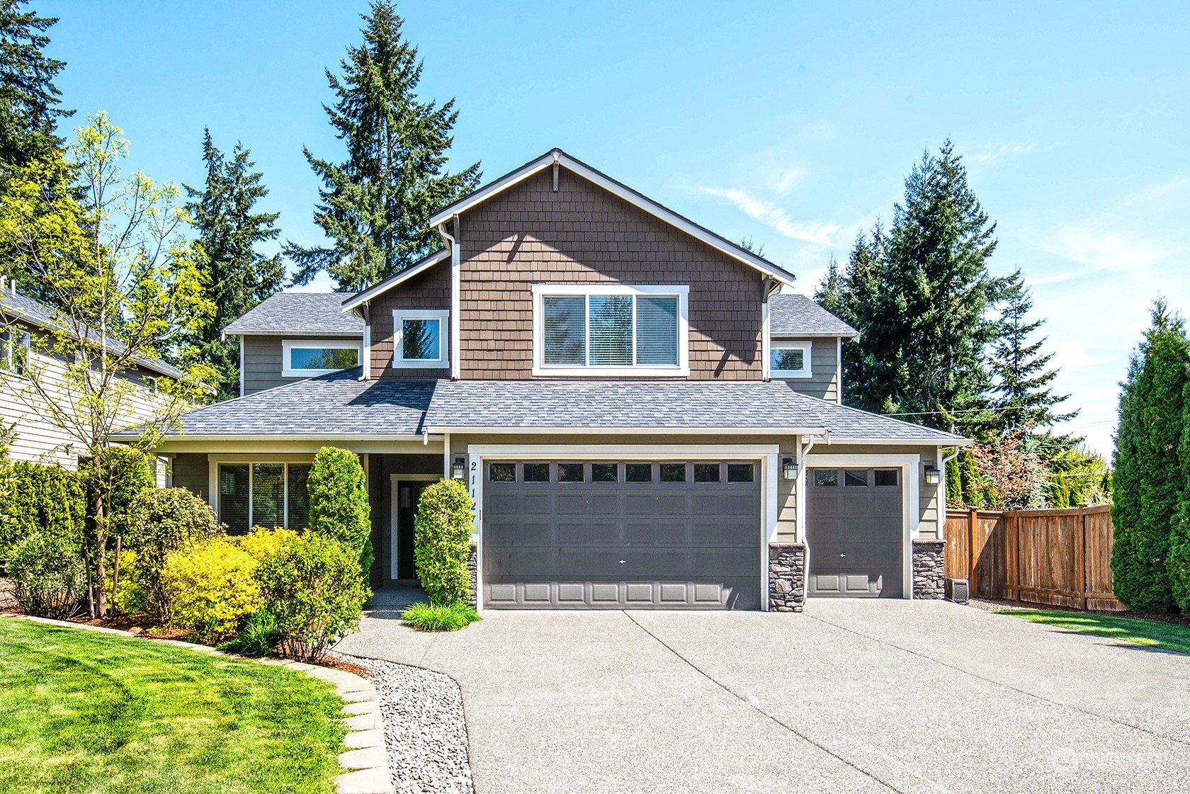 21127 35th Drive Southeast Bothell, WA 98021 - Photo 1 of 40 a front view of a house with garden