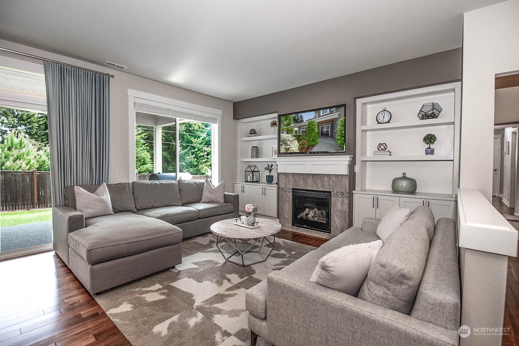 21127 35th Drive Southeast Bothell, WA 98021 - Photo 18 of 40 a living room with furniture and a fireplace