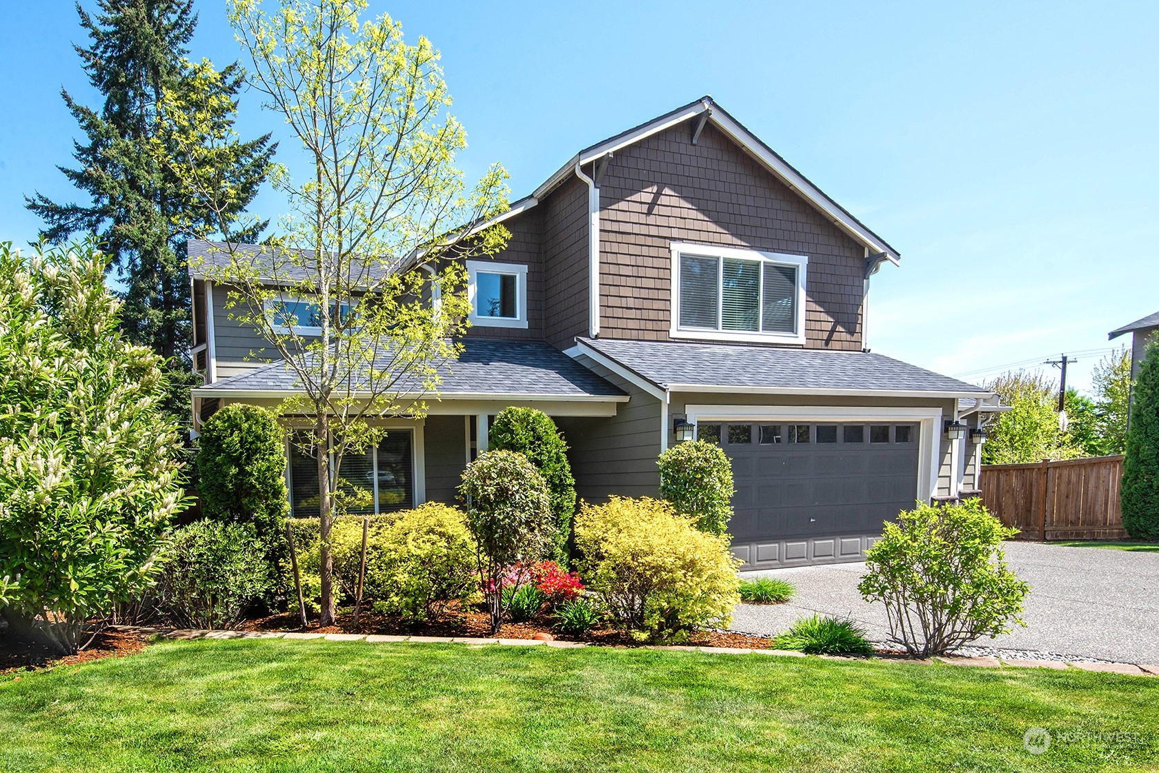 21127 35th Drive Southeast Bothell, WA 98021 - Photo 2 of 40 a front view of house with a garden