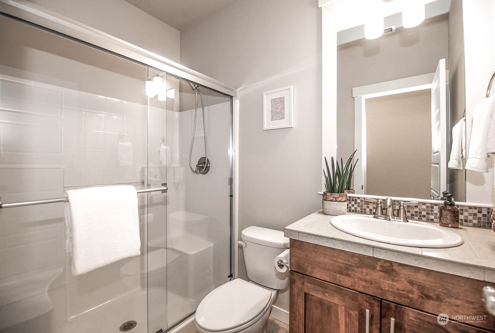 21127 35th Drive Southeast Bothell, WA 98021 - Photo 21 of 40 a bathroom with a sink toilet and shower