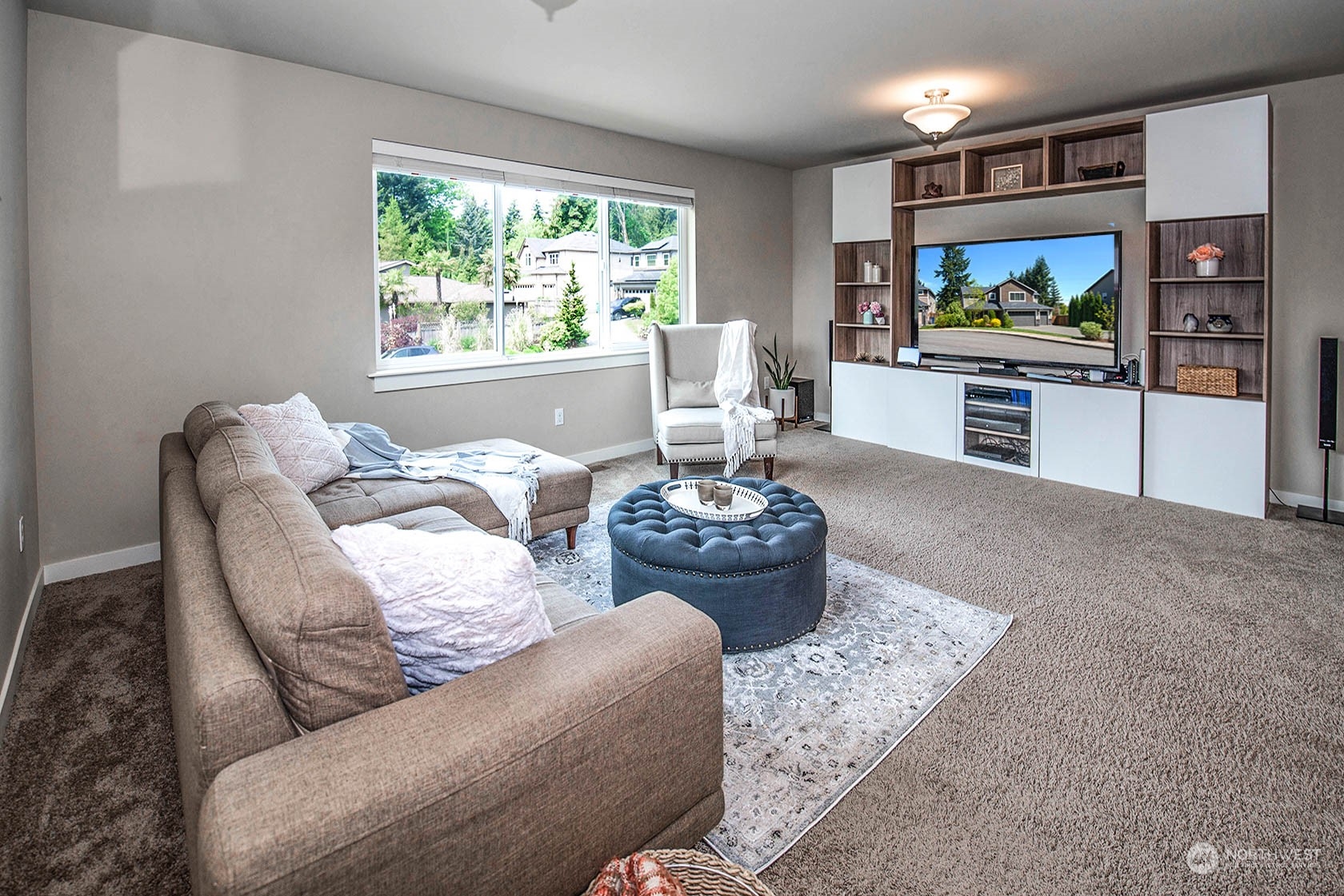 21127 35th Drive Southeast Bothell, WA 98021 - Photo 25 of 40 a living room with furniture and a flat screen tv