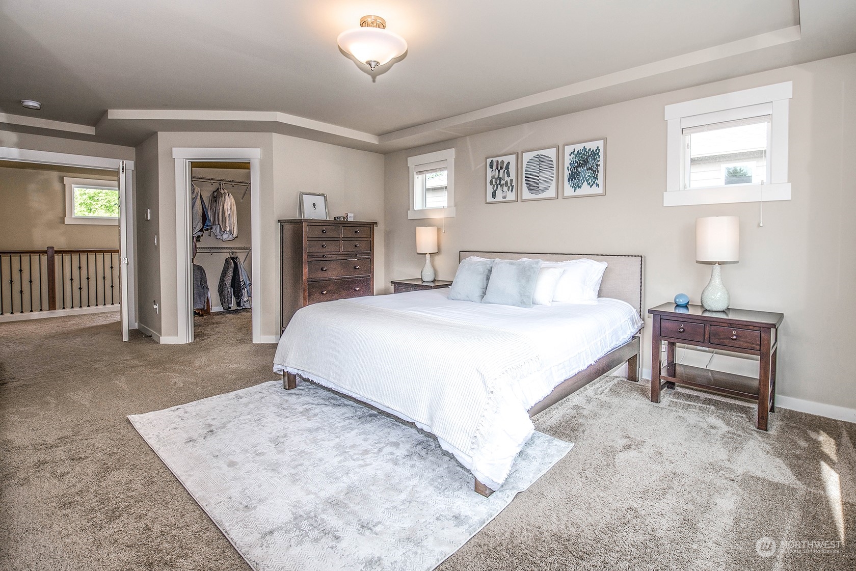 21127 35th Drive Southeast Bothell, WA 98021 - Photo 27 of 40 a spacious bedroom with a bed table and a window