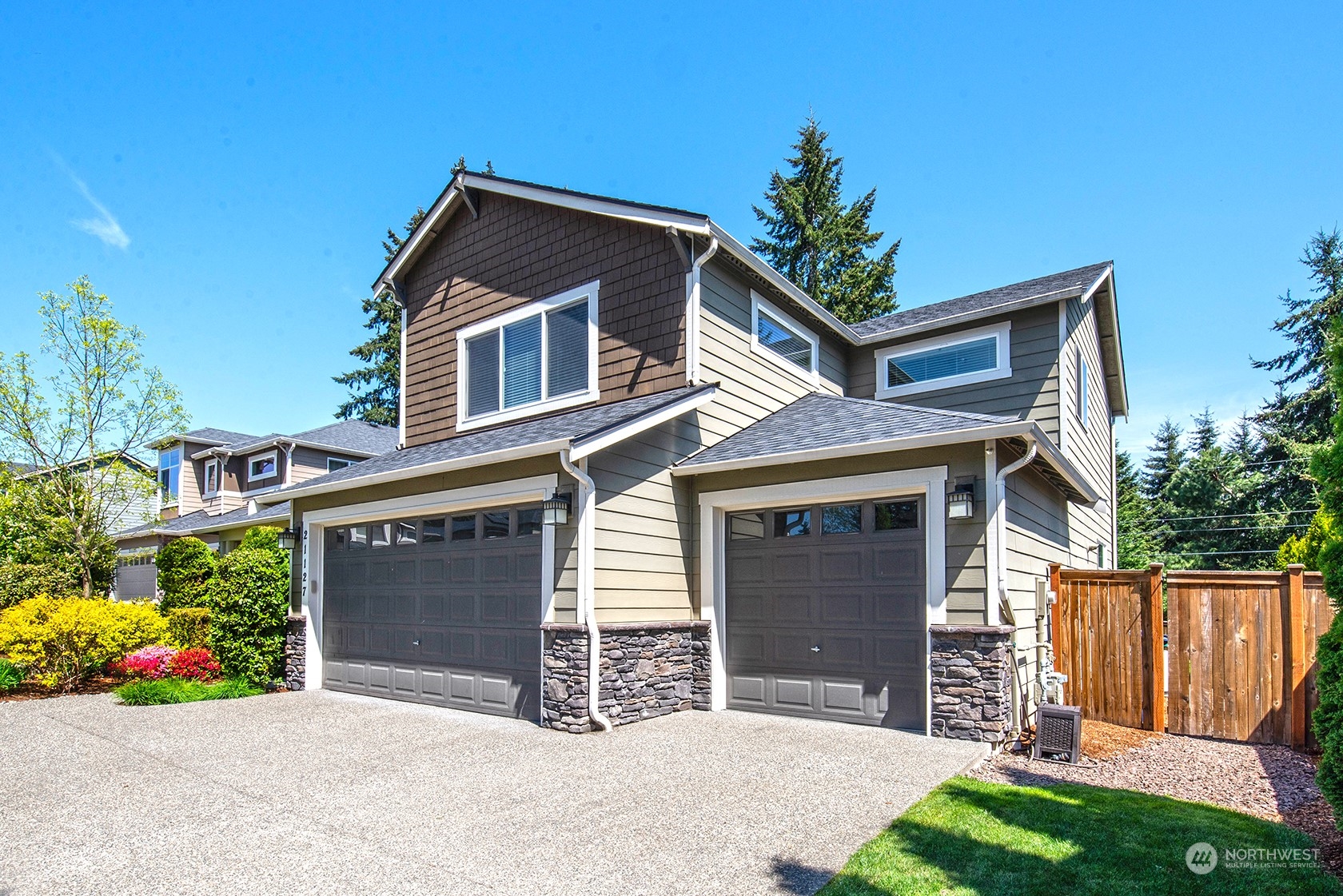 21127 35th Drive Southeast Bothell, WA 98021 - Photo 3 of 40 a front view of a house with a yard