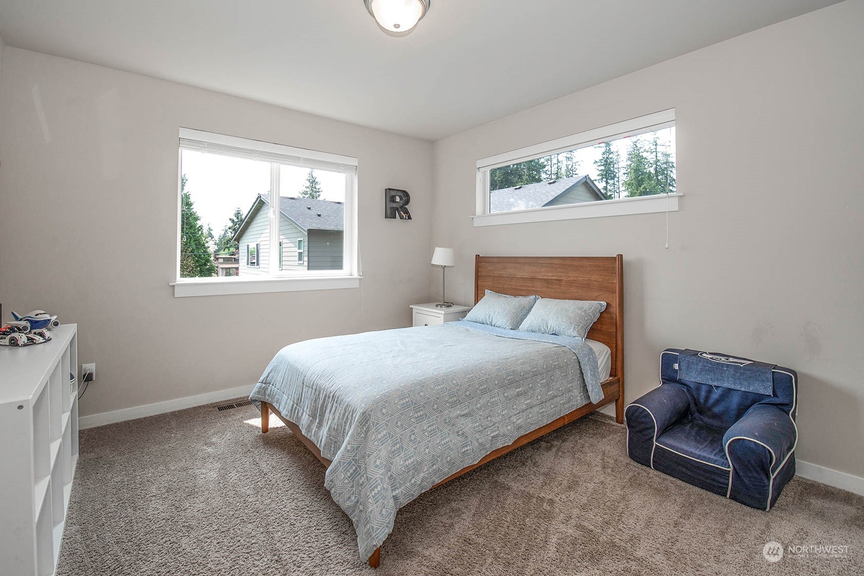 21127 35th Drive Southeast Bothell, WA 98021 - Photo 31 of 40 a bedroom with furniture and a window