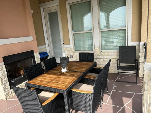 a kitchen with granite countertop a refrigerator stove and sink