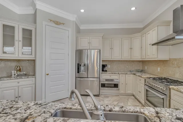 a bedroom with a bed and ceiling fan